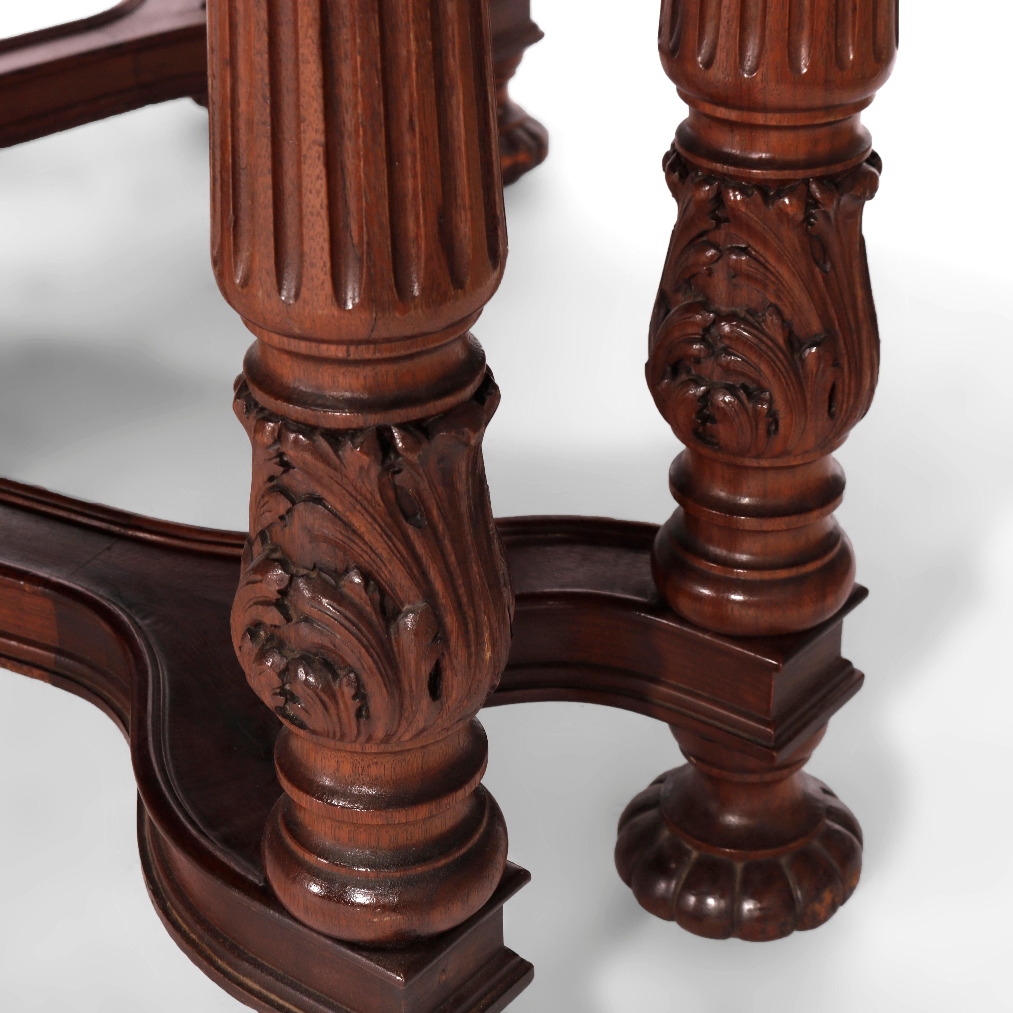 An antique Neoclassical dining extension dining table offers walnut construction with clip corner top having skirt with burl reserves and dental molding raised on double fluted legs having carved acanthus and stylized x-stretcher, c1930

Measures-