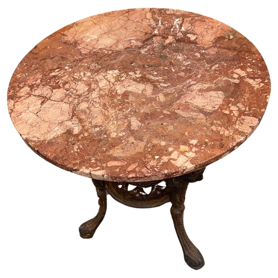 Antique Neoclassical Cast Iron Marble Top English Pub Table

Fantastic Early 1900's Neoclassical Ornate Figural Cast Iron Base with Round Italian Marble Top Pub Table. This English table is a solid, sturdy classic antique side table. It is suitable