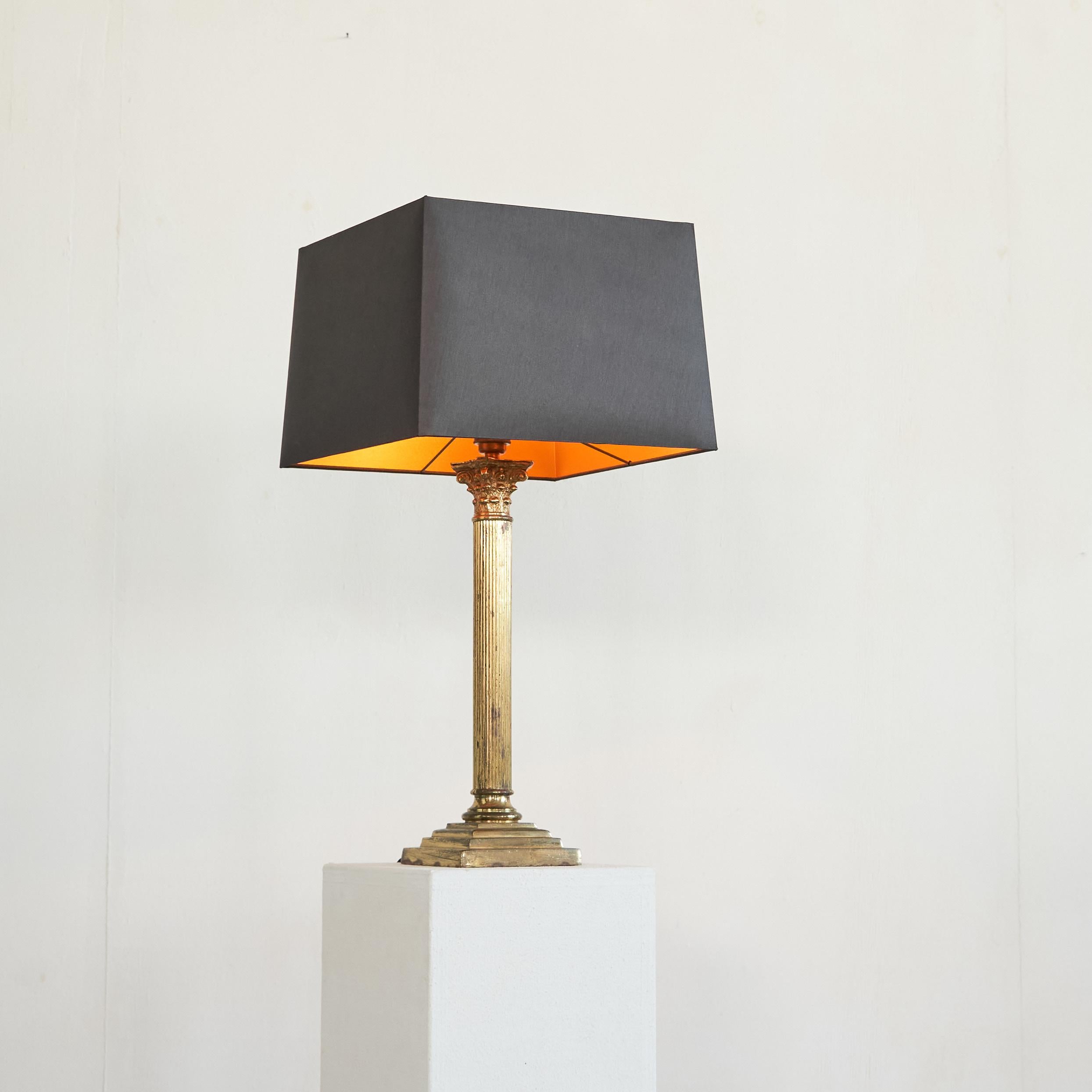 Antique Neoclassical Column Table Lamp in Patinated Brass.

Converted from an antique oil lamp, this neoclassical column table lamp is a heavy and beautifully patinated piece. Great proportions and execution in brass, which gained a wonderful patina