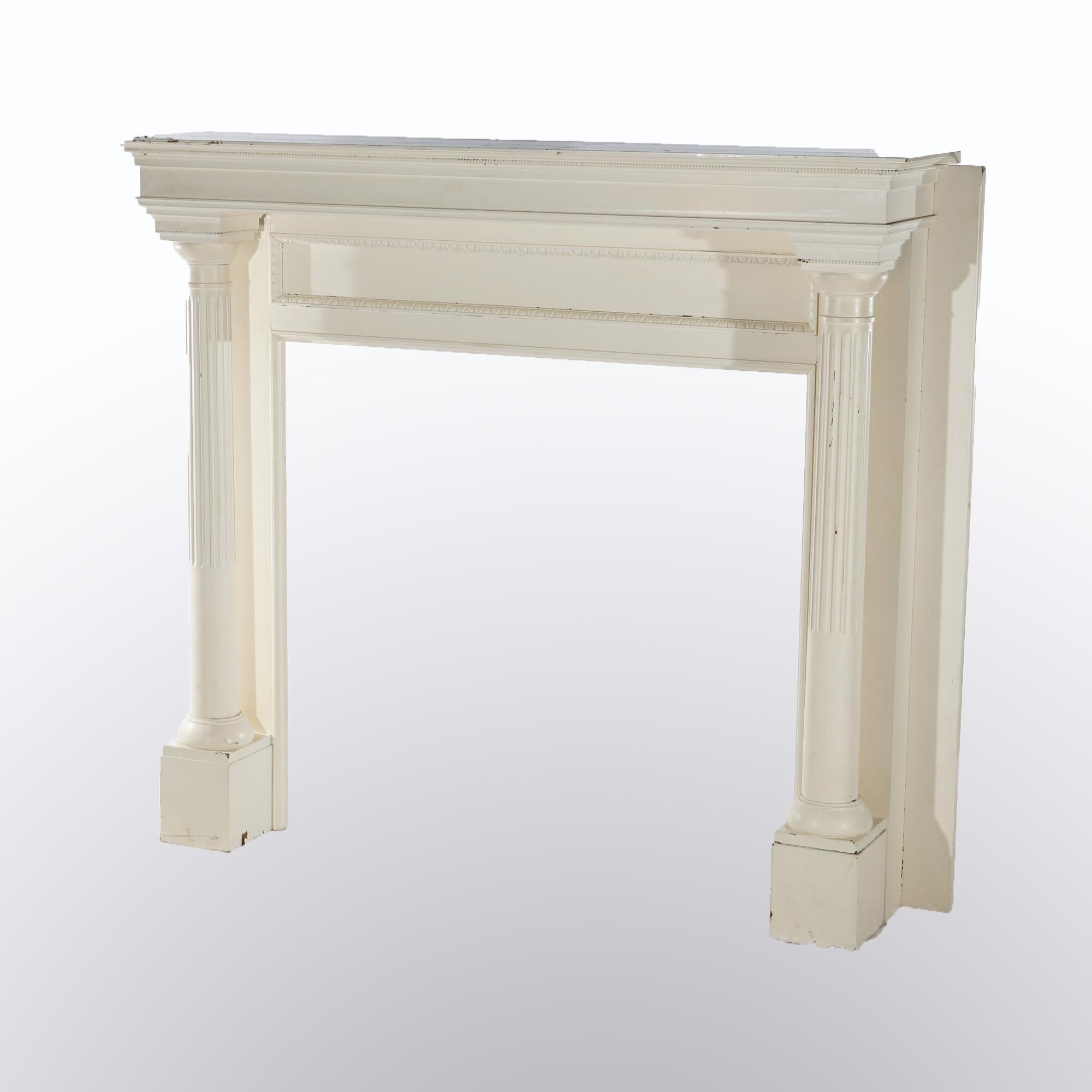 An antique Neoclassical fireplace mantle offers custom painted oak construction with flanking Greek Doric fluted columns, c1920

Measures - 54.75