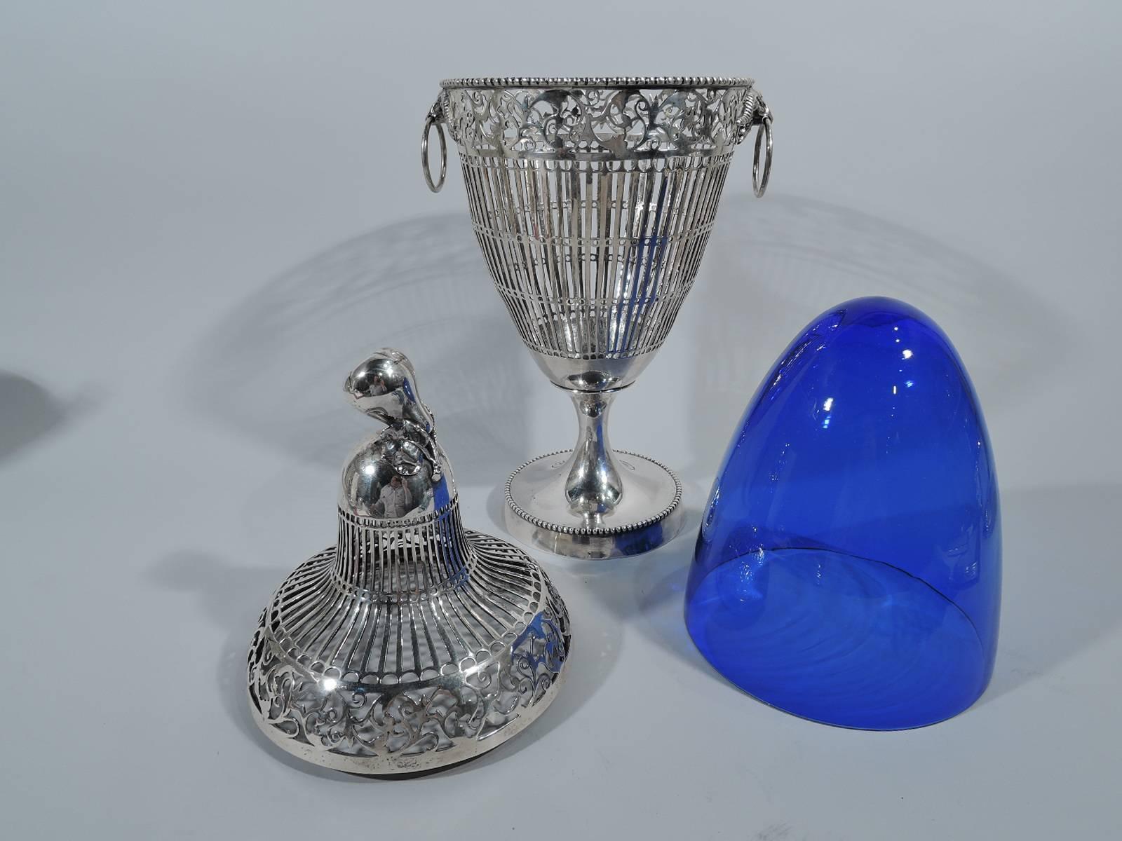 Striking German neoclassical sterling silver covered urn with cobalt glass liner. Imported to England in 1904 by Berthold Hermann Muller in Chester. Ovoid bowl on short and slender stem terminating in raised and round foot. Cover double-domed with