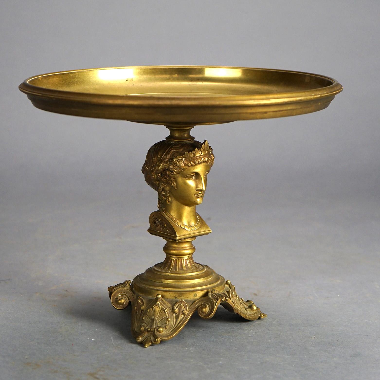 Antique Neoclassical tazza offers cast bronze construction with tray over figural woman column raised on foliate embossed feet, 19thC

Measures- 8.5''H x 10.75''W x 10.75''D