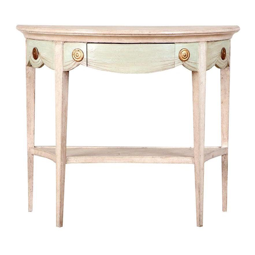A beautiful antique, warm-ivory/pale blush and pale green painted dekmilune console table with gilt detailing. Directoire style. Piece is fragile but in good condition. Simple center drawer.