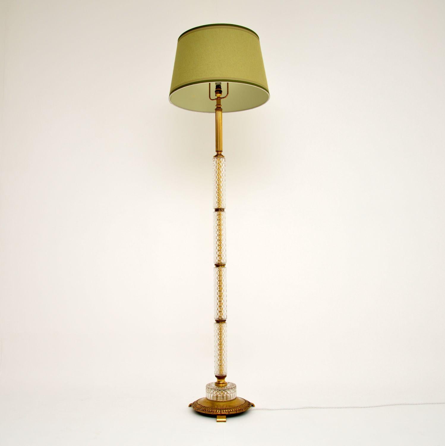 Antique neoclassical crystal glass and brass floor lamp in excellent condition and dating to circa 1950s period.

This standard lamp has just been rewired and has a nice shade to match it. The stand has quite a few separate segments of crystal cut