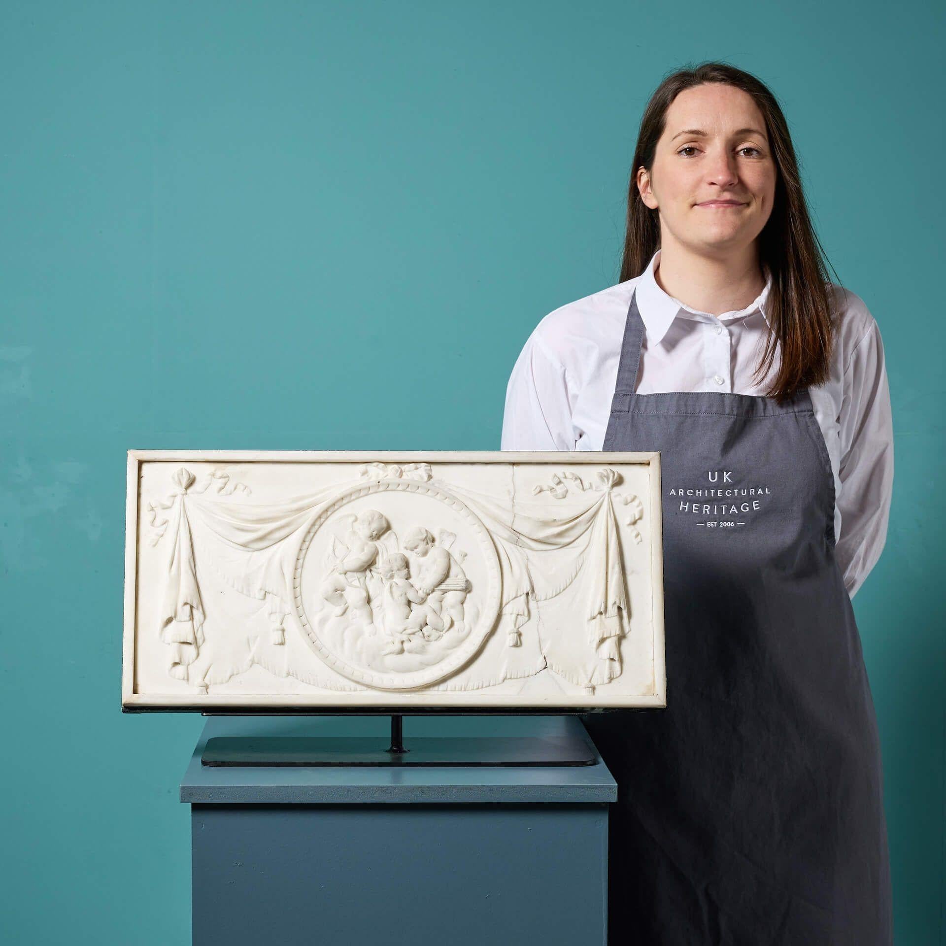 A stunning late 18th/early 19th century neoclassical white statuary marble chimneypiece tablet mounted on a stand. Originally from a property in Mayfair, London, this large scale antique chimneypiece tablet would have once been part of a very large