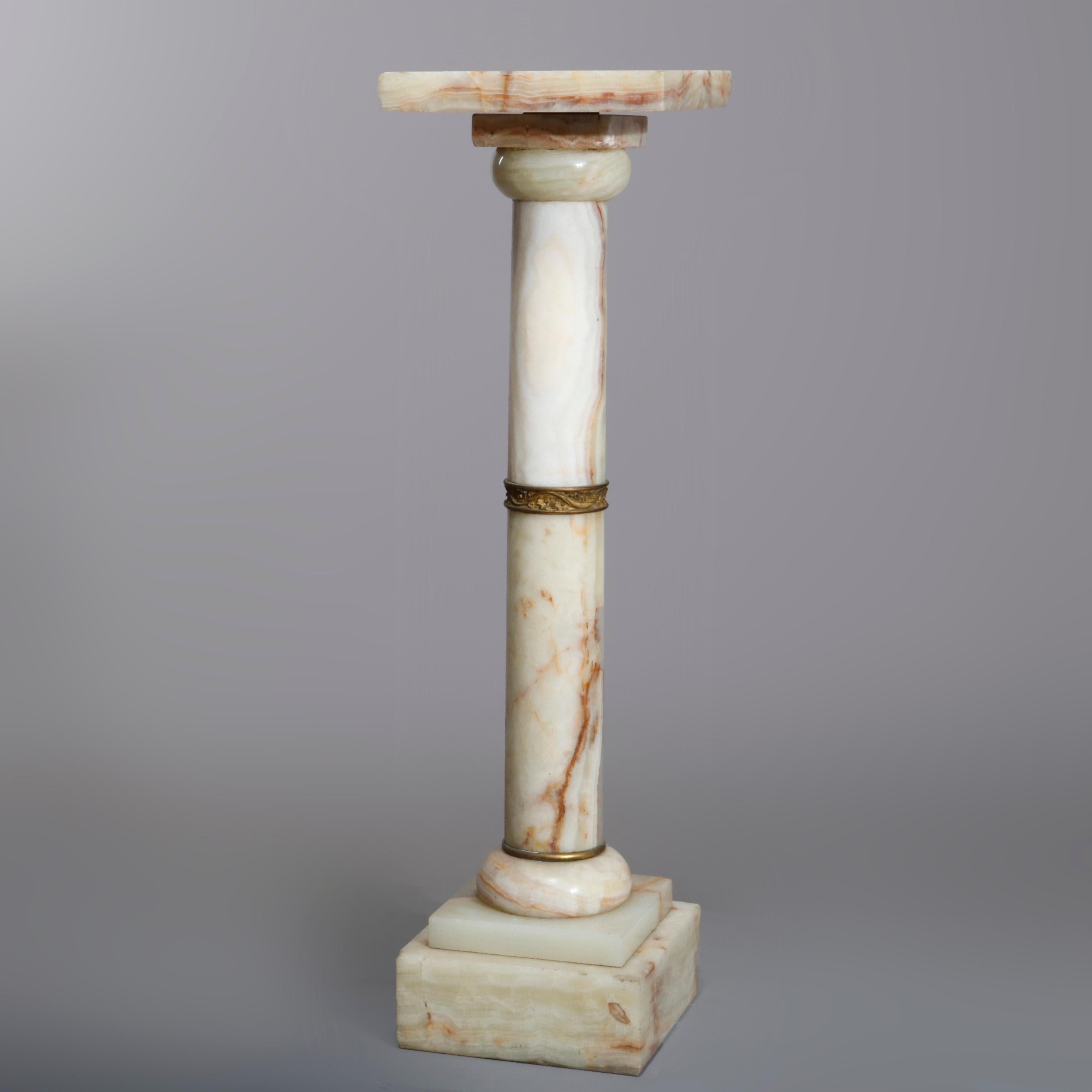 An antique sculpture display pedestal offer onyx and ormolu construction in Neoclassical Doric style column form with ormolu band, circa 1890.

Measures: 38