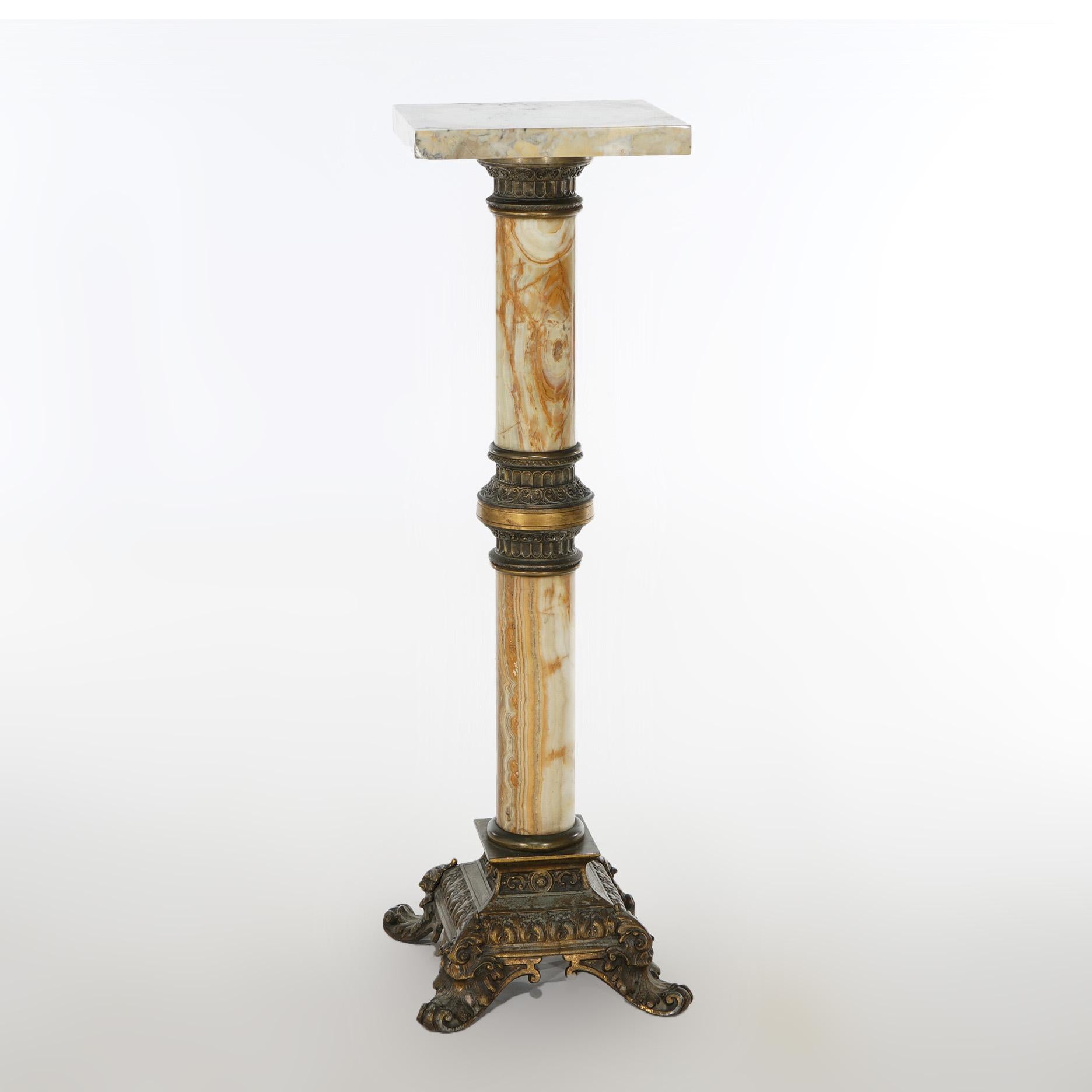 An antique Neoclassical pedestal offers onyx construction with square display platform over cast bronze banded column and raised on foliate cast bronze footed base, c1870

Measures - 38.5