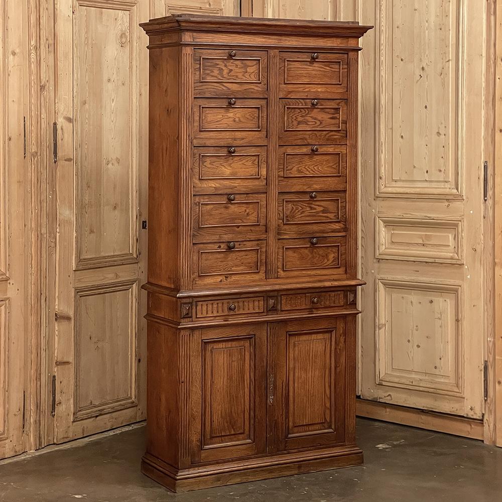 Antique Neoclassical Pharmacy file cabinet was used to store & organize medicines but could easily be adapted to organize any small items placing them at your fingertips! Taking up an incredibly small footprint, its space efficiency cannot be