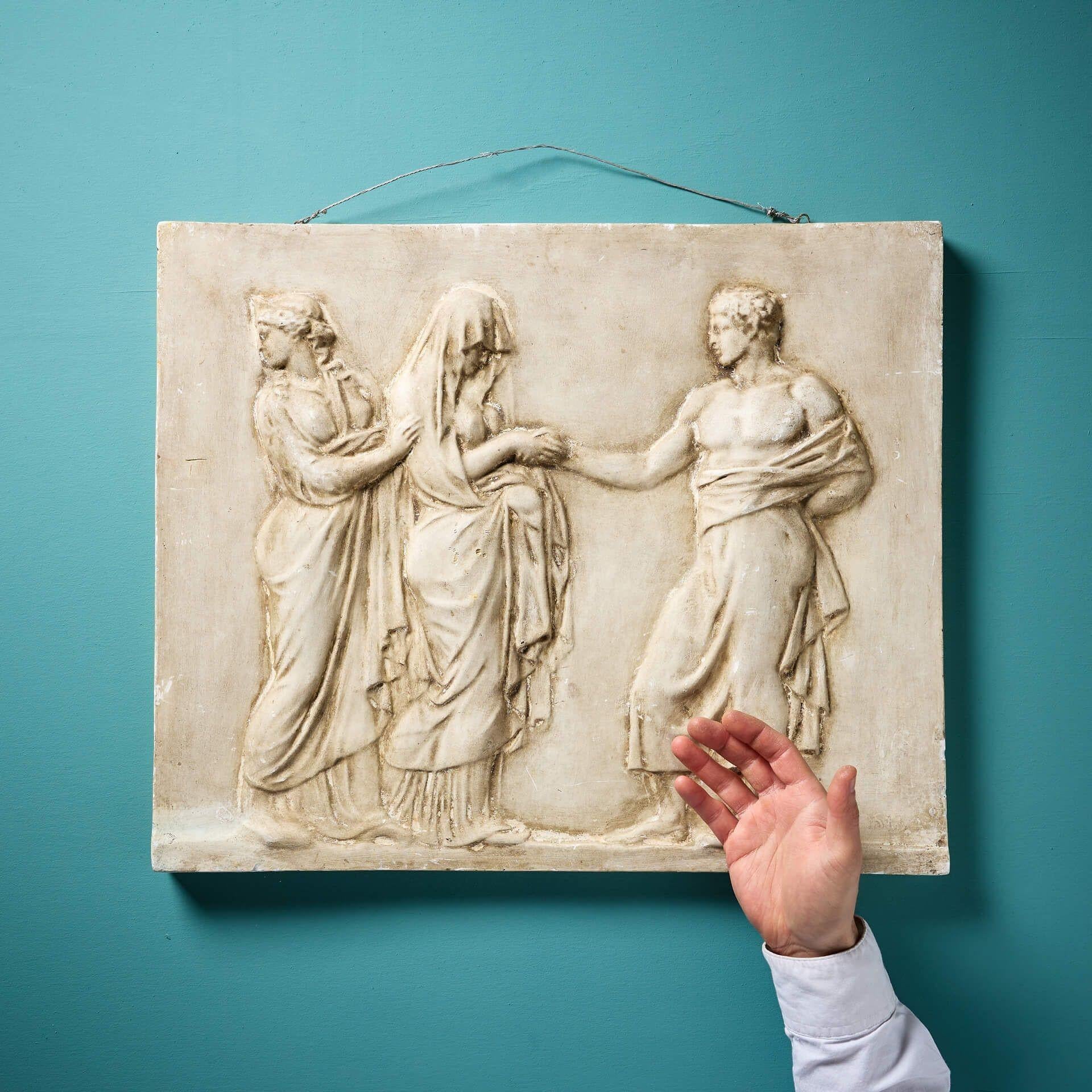 An early 20th century neoclassical plaster relief panel depicting the marriage of Peleus and Thetis after the antique, indistinctly marked to the bottom right corner.

This decorative antique panel, which comes with a wire attached to the top for