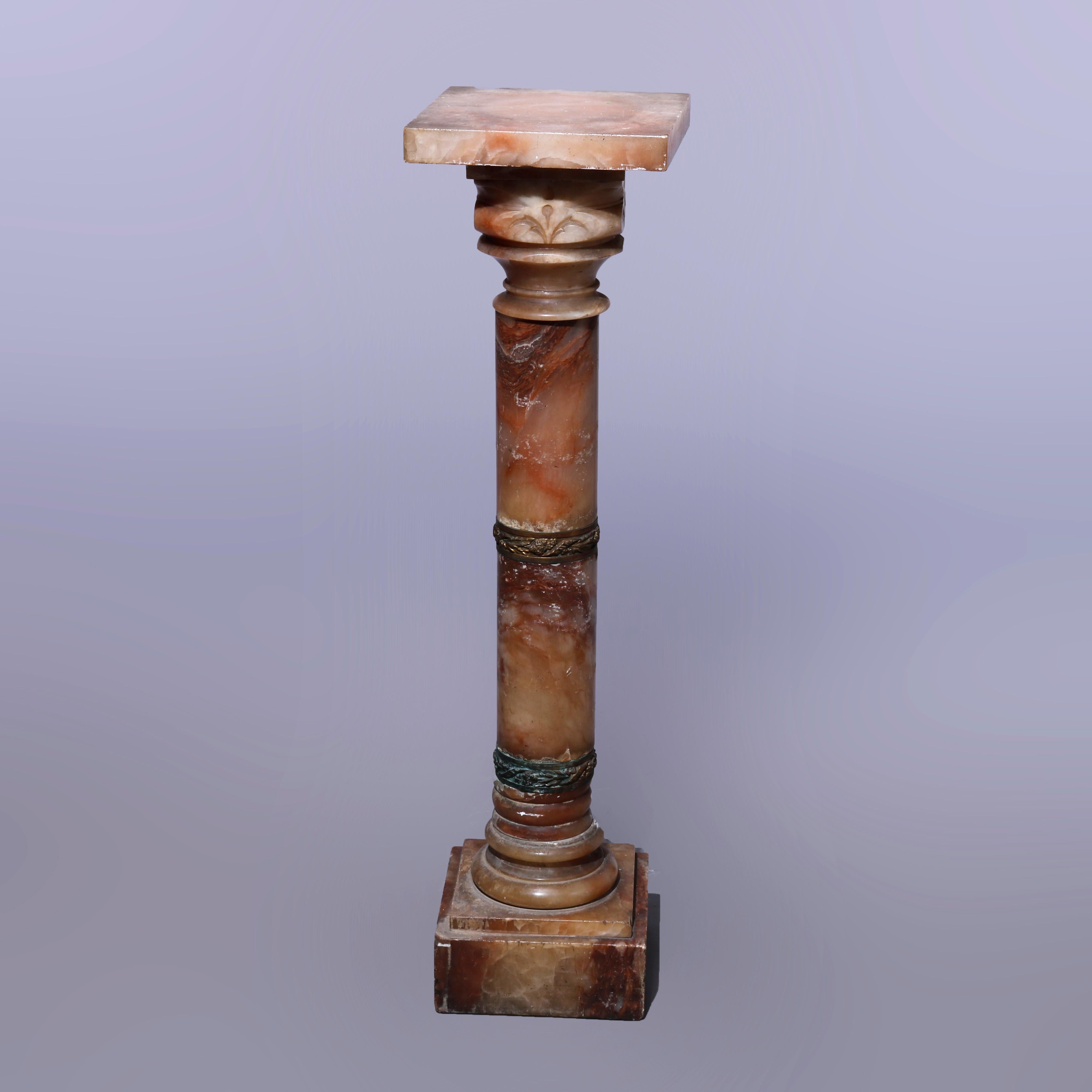An antique Neoclassical sculpture pedestal offers rouge onyx construction with square display over turned and foliate cast bronze banded Doric column, raised on square block base, c1890.

Measures - 41.75''H x 10''W x 10''D.

Catalogue Note: Ask