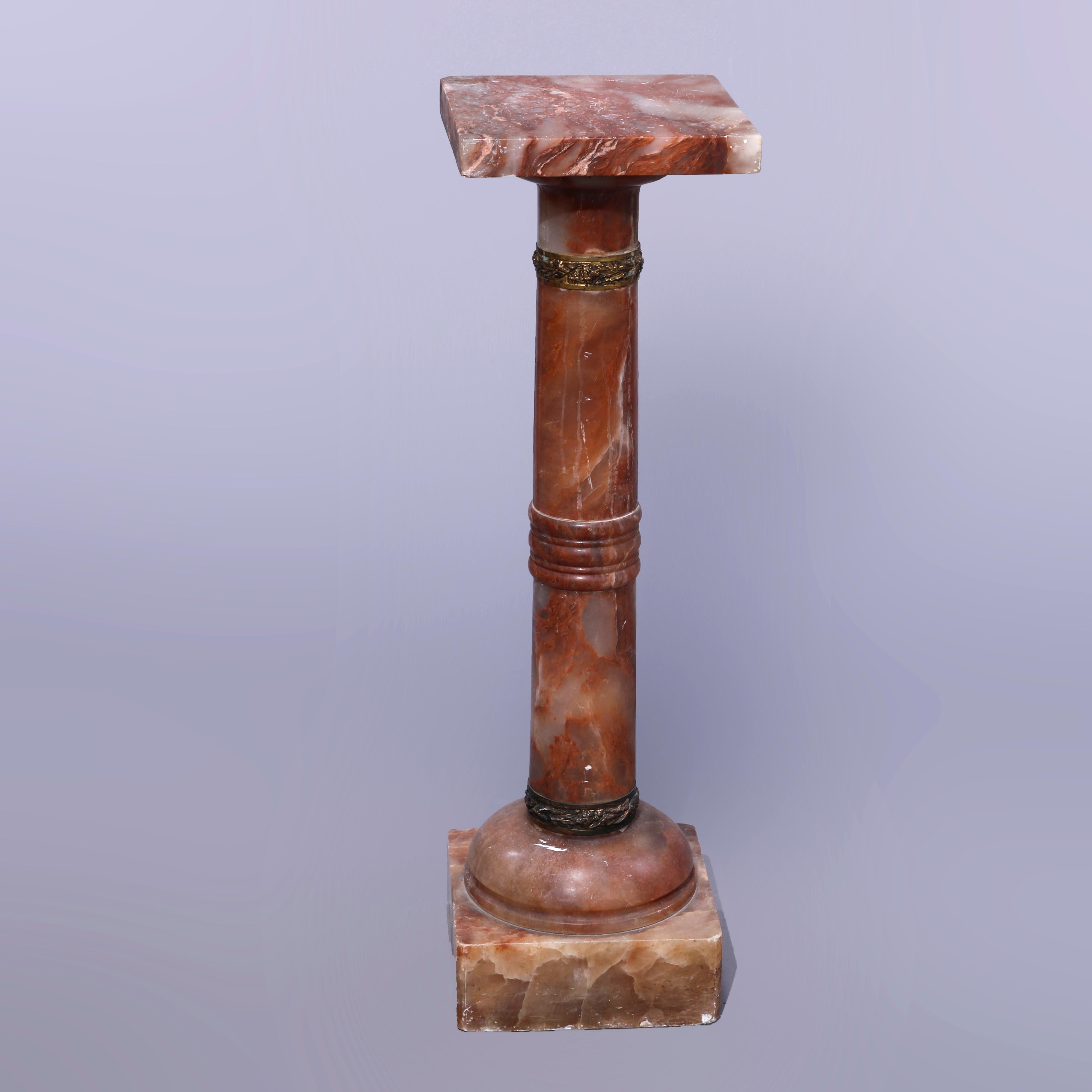 An antique Neoclassical sculpture pedestal offers rouge onyx construction with square display over turned and foliate cast bronze banded Doric column, raised on square block base, c1890

Measures - 38''H x 11''W x 11''D.

Catalogue Note: Ask about