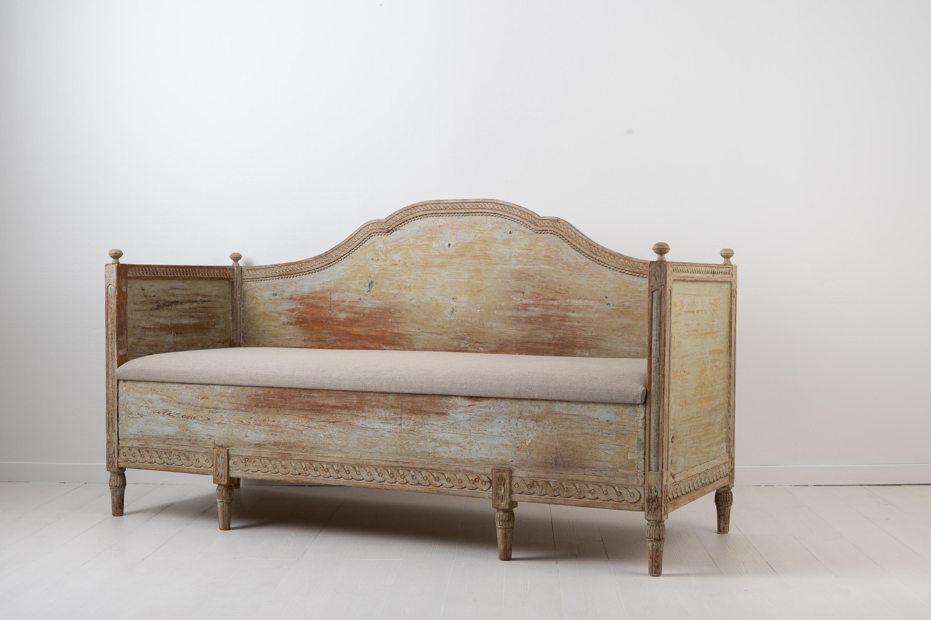 Antique Swedish sofa from the late 18th century. The sofa or bench is made from Swedish pine and painted with the original first layer of paint. The sofa is Gustavian in Swedish terms which is equivalent to the more international neoclassical