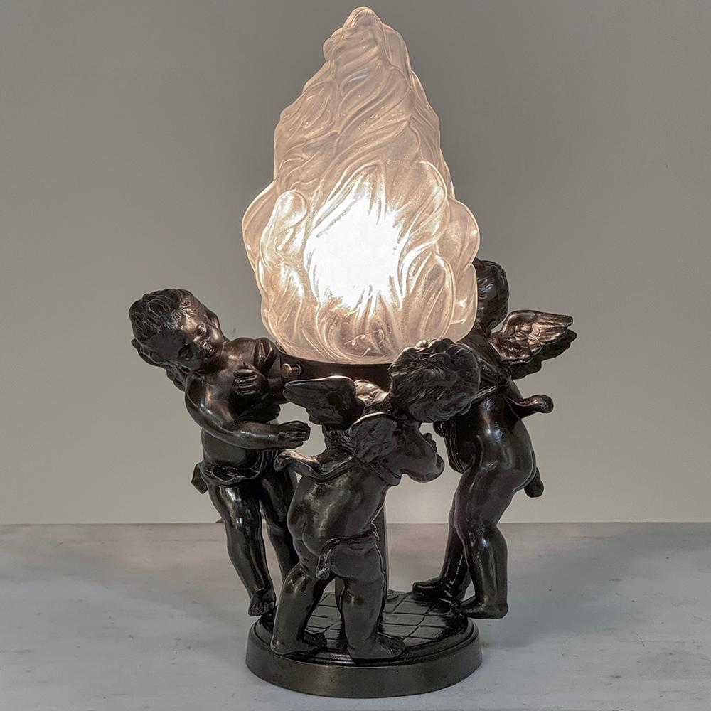 Antique Neoclassical Spelter Table Lamp ~ Girandole with Bronze Finish will make a charming accent light for your favorite room!  Depicting three playful cherubs dancing around in a circle, the center is a pedestal that contains a single medium base