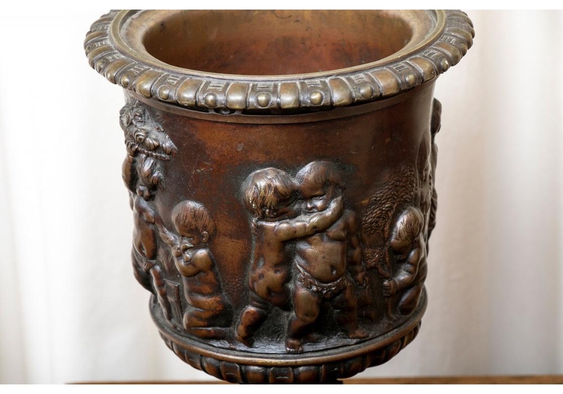 19th Century Antique Neoclassical Style Bronze Urn with Putti in Relief For Sale