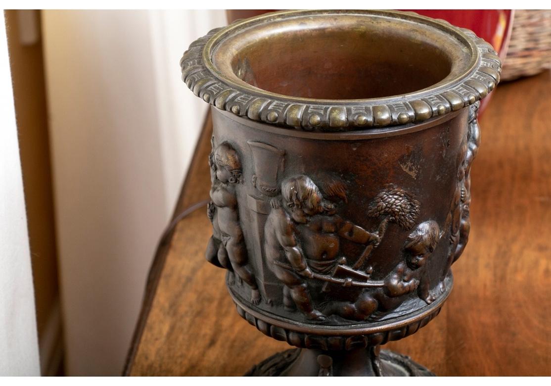 Antique Neoclassical Style Bronze Urn with Putti in Relief For Sale 3