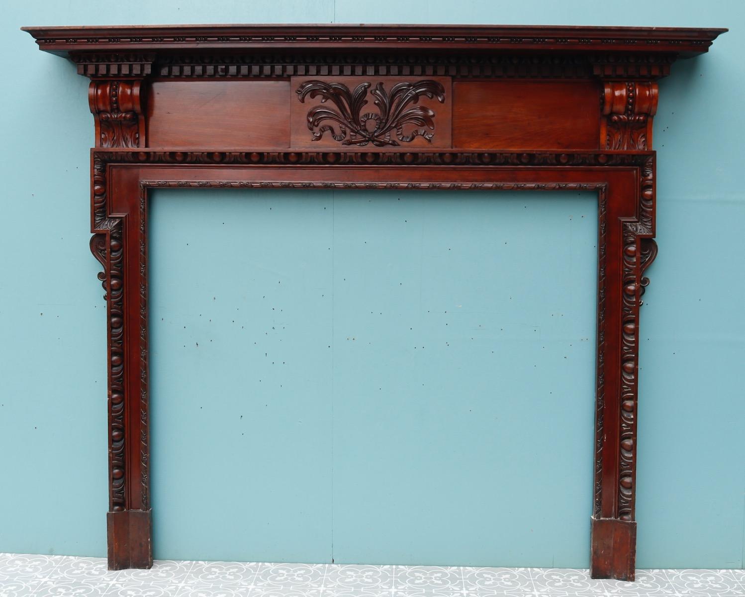 A carved mahogany fire surround in the Neoclassical style.
Additional dimensions
Opening height 112.5 cm
Opening width 130 cm
Width between outsides of the foot blocks 154.5 cm.