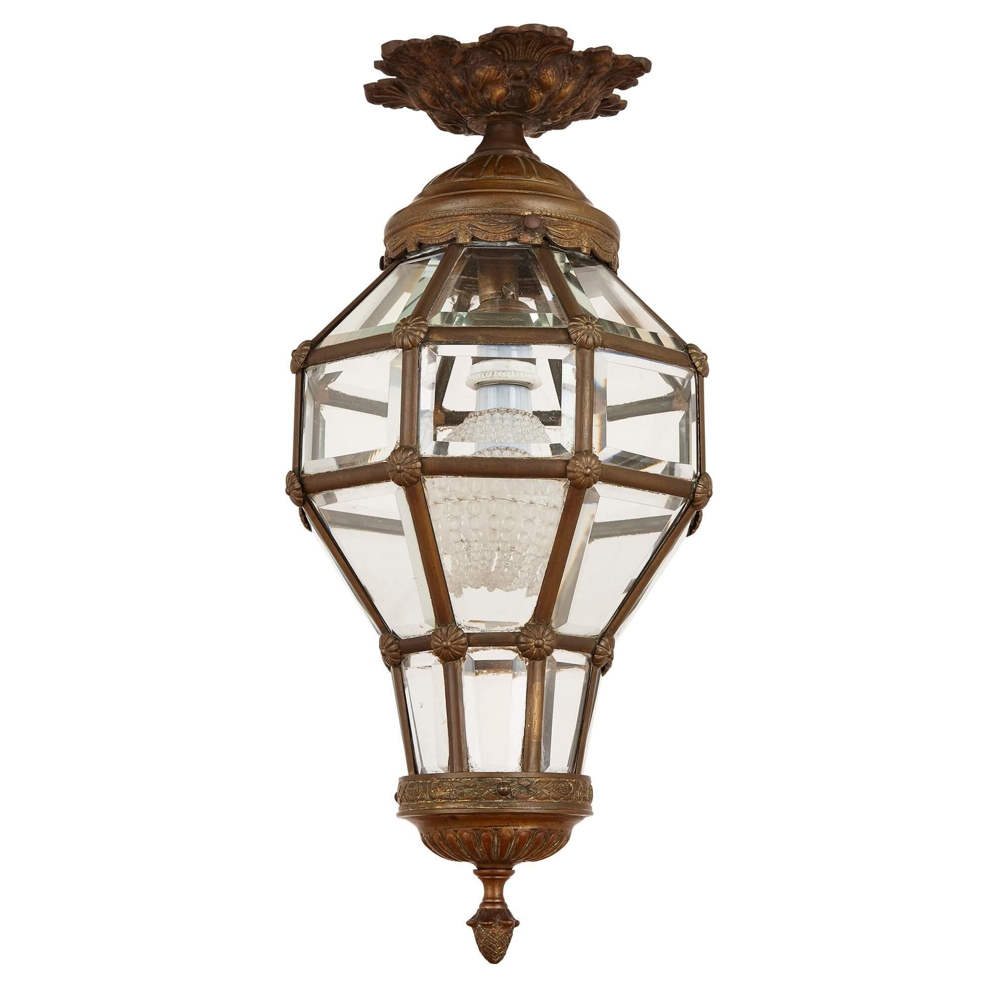Antique Neoclassical style glass and gilt bronze lantern,
French, late 19th century
Measures: Height 46cm, diameter 21cm

This fine, antique lantern was made after an 18th century model for the Chateau of Versailles, and takes the octagonal