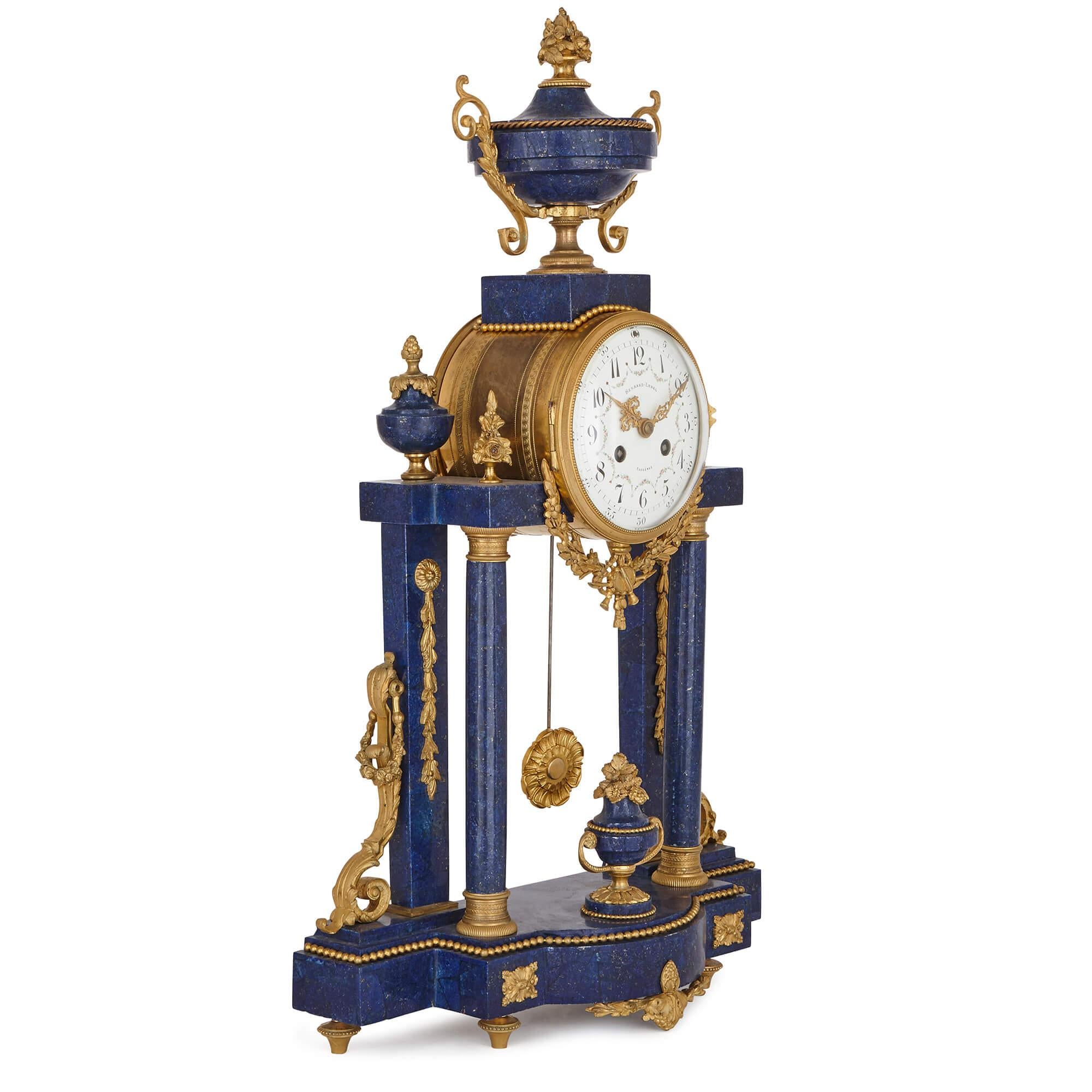 This fine three piece clock set was made in the late 19th century, and enhanced more recently with a rich lapis lazuli veneer. Designed in the timeless neoclassical style, the set is a splendid example of an antique piece which can be placed in