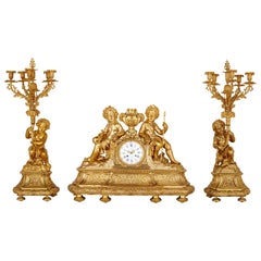 Antique Neoclassical Style Three-Piece Gilt Bronze Clock Set