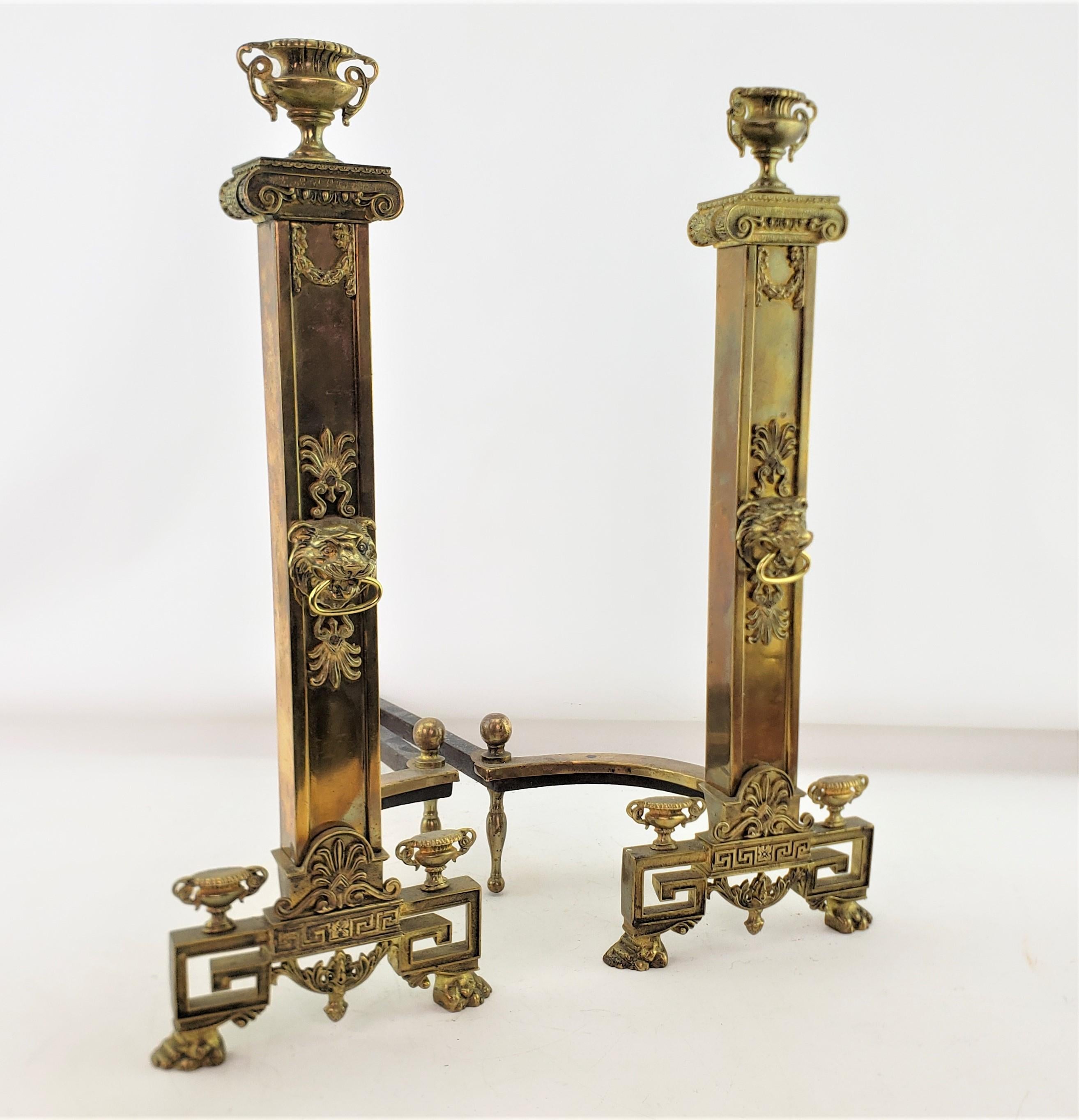 Cast Antique Neoclassical Styled Andirons with Brass Urns & Lion Head Accents For Sale