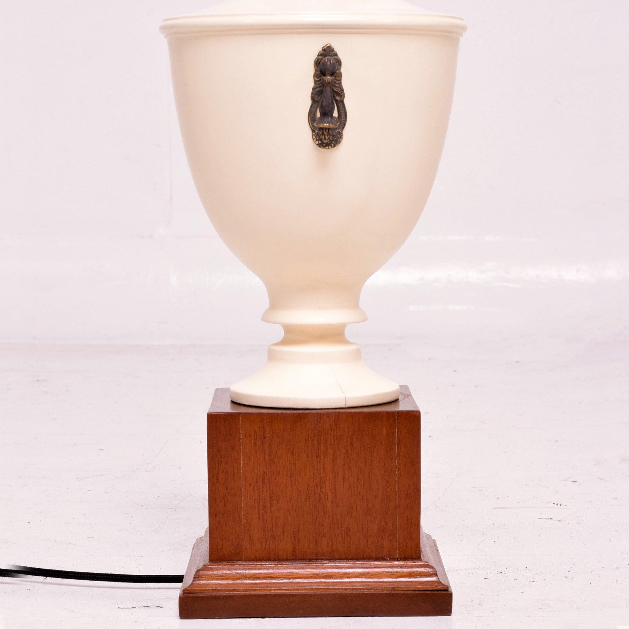 For your consideration a pair of neoclassical table lamps. Urn shape with bronze and brass accents details.

The urn is made of solid mahogany wood, Mounted in a wood pedestal base.

Rewired, restored. No shade included. 
Mexico, circa
