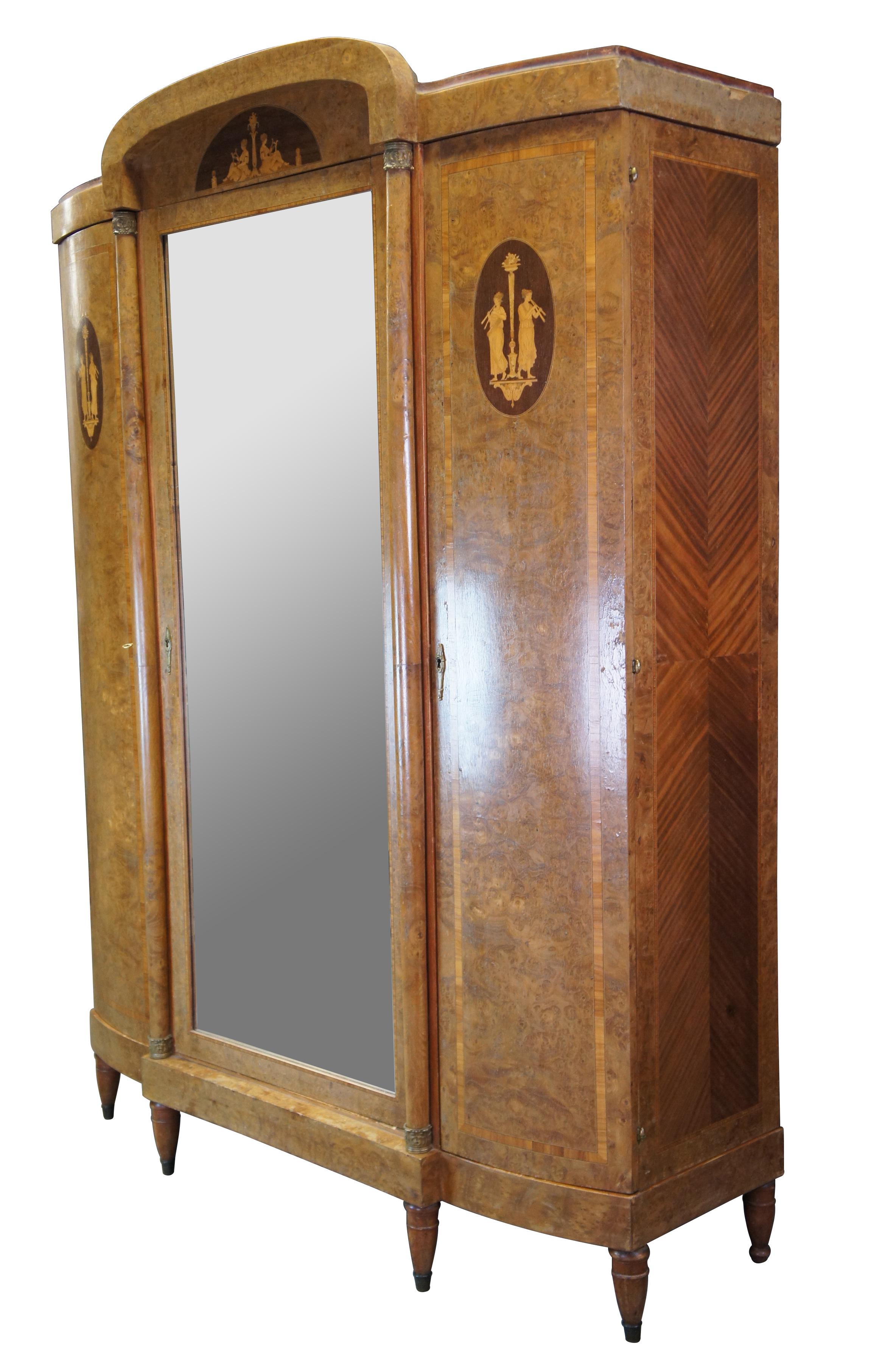 A beautiful Italian Neoclassical knockdown armoire or wardrobe from the last quarter of the 19th century. Rectangular in form with bowfront and domed top, accompanied by graceful brass capped columns along the front. Made from walnut and olive ash