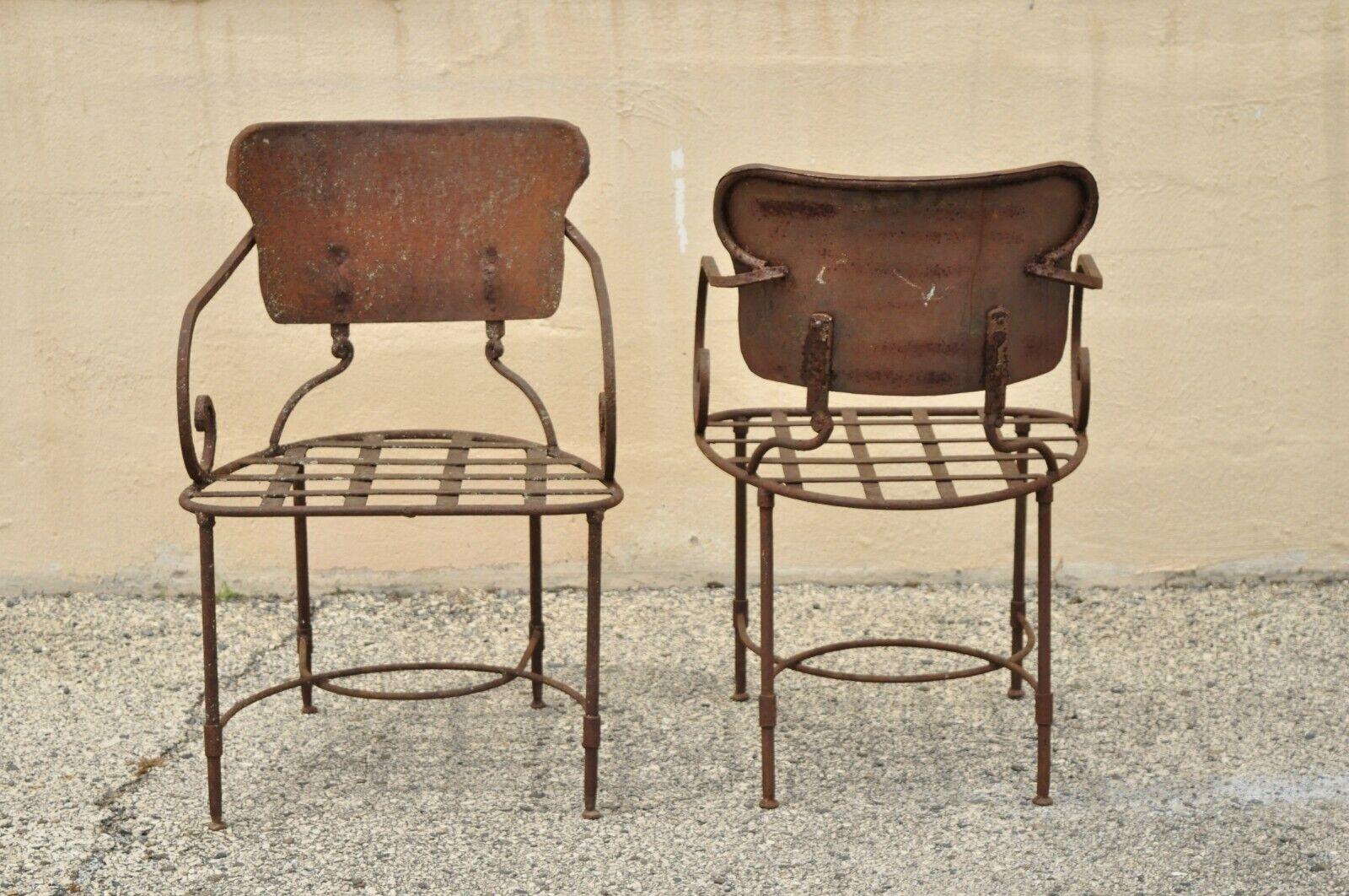 Antique Neoclassical Wrought Iron Outdoor Garden Scrolling Arm Chairs, a Pair In Distressed Condition In Philadelphia, PA