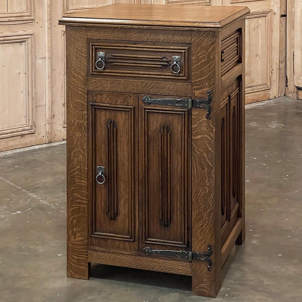 Antique Neogothic Cabinet was designed to provide a maximum of storage space in the most diminutive of niches!  Barely two feet wide at the widest point of the top surface, it will nestle in very narrow spaces or be the perfect choice between
