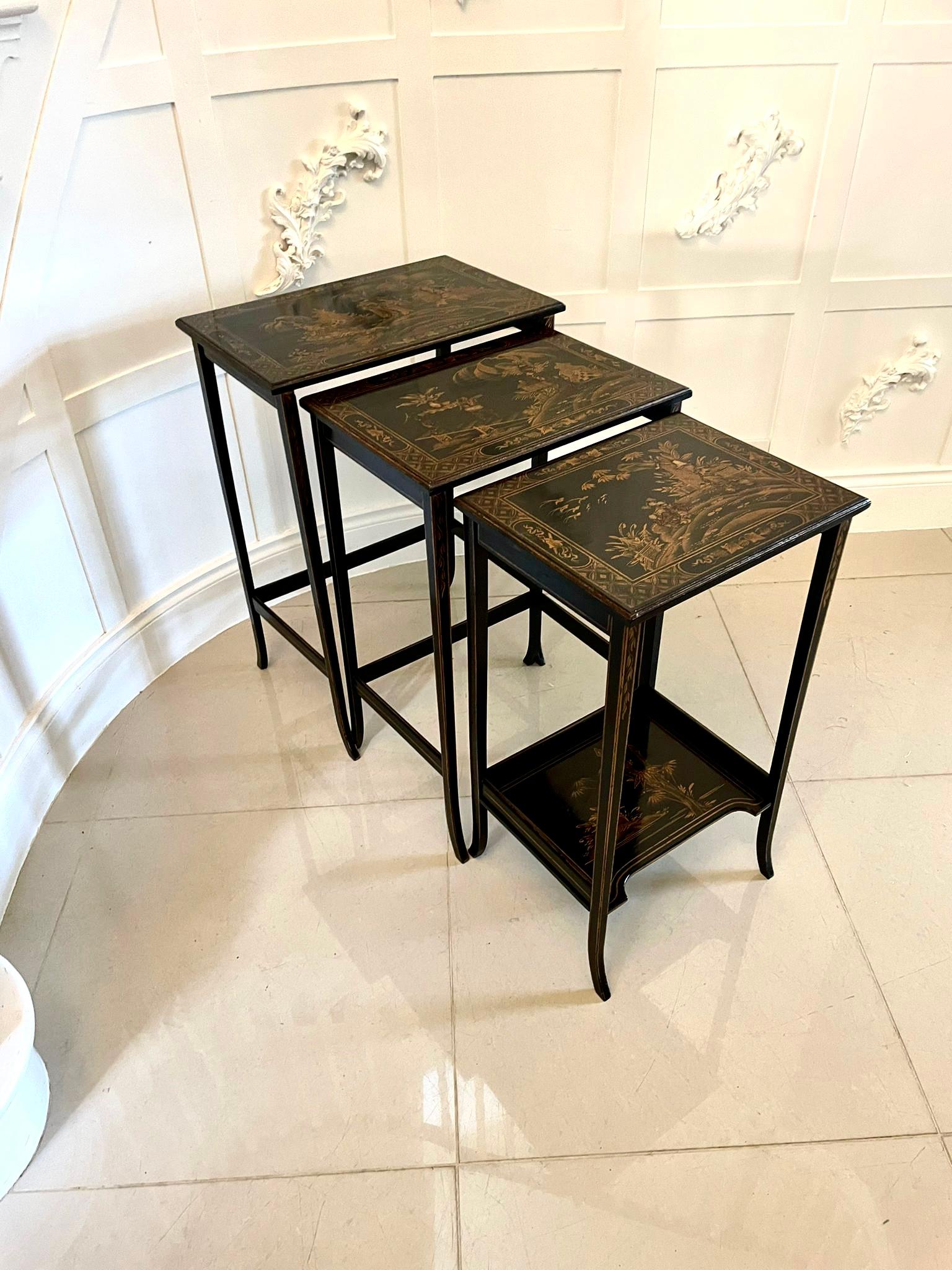 Antique nest of 3 quality chinoiserie decorated tables having rectangular shaped tops boasting a delightful black and gold background with quality chinoiserie decoration and a moulded edge standing on 4 square elegant tapering black and gold legs