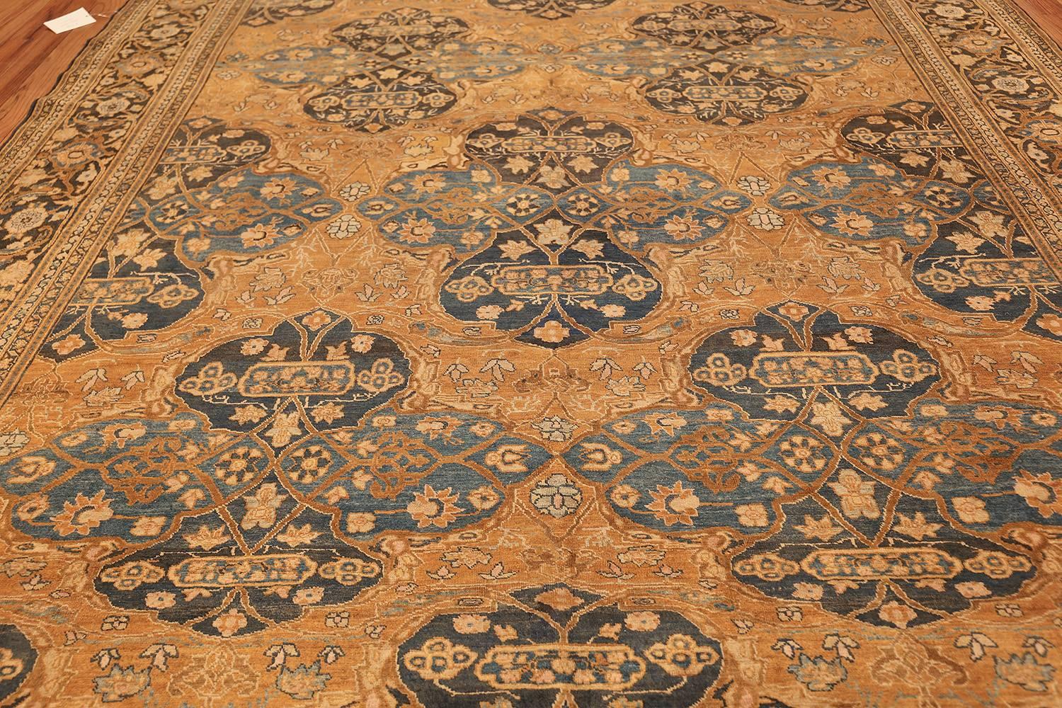 Beautiful and extremely decorative antique neutral earth tone color Persian Khorasan rug, country of origin / rug type: Persian rug, circa date: 1920.  Size: 9 ft x 12 ft 5 in (2.74 m x 3.78 m).