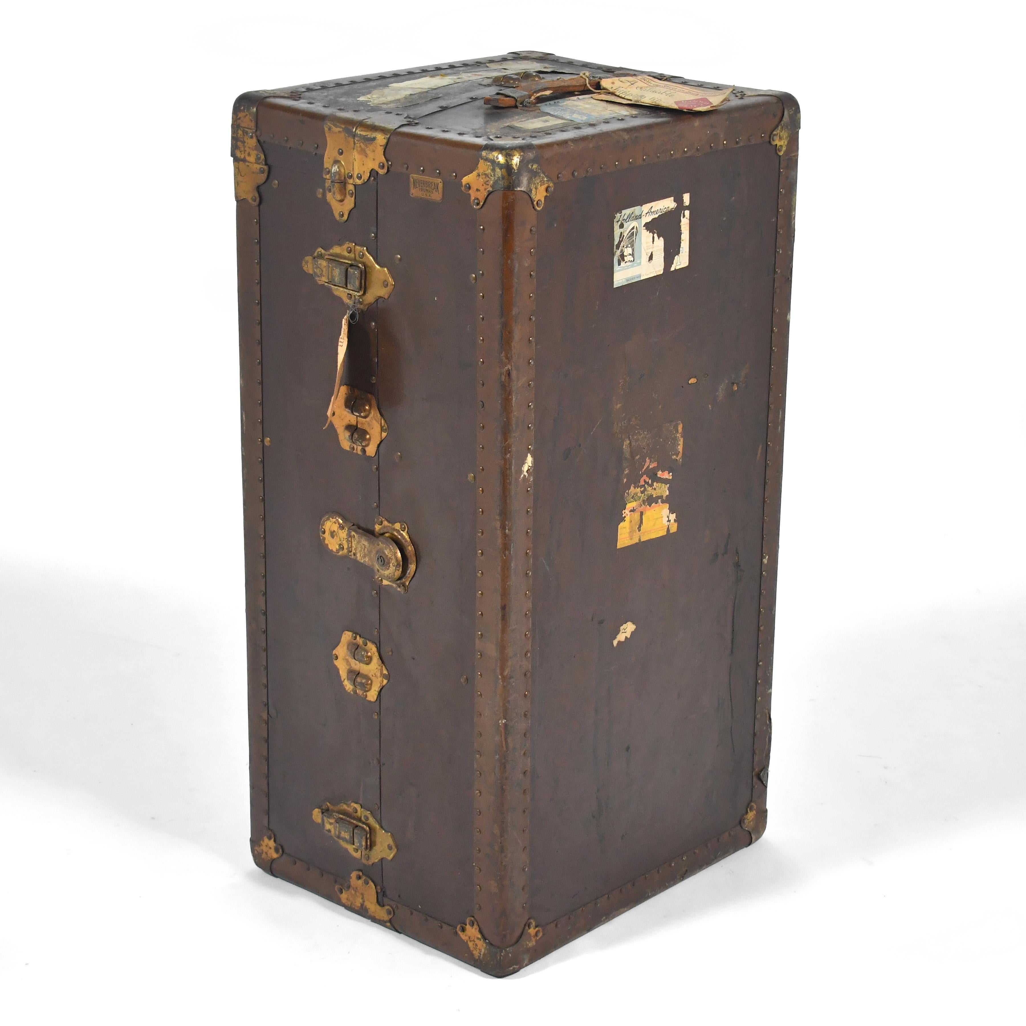 This beautiful steamer chest is from the early 20th century and is covered in history. It was made for Neverbreak Trunks U.S.A. by L. Goldsmith & Son of Newark, NJ and is covered with history.

It can of course be used for its intended purpose, but