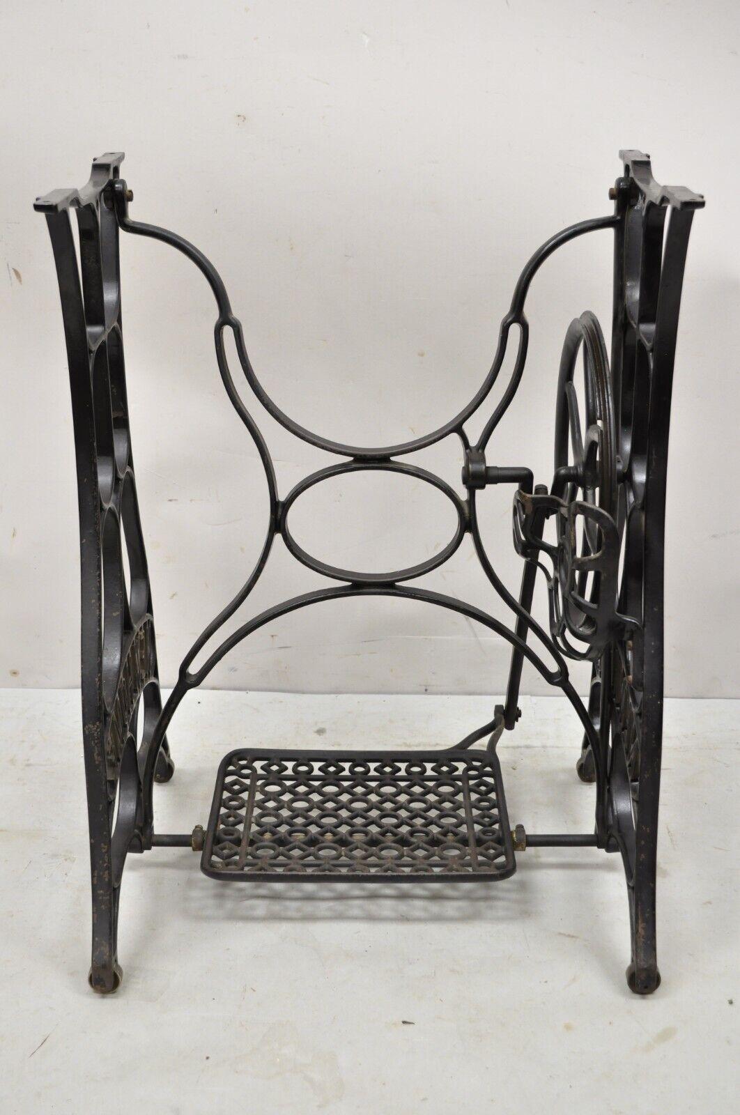 Antique New Home Black Cast Iron Treadle Sewing Machine Base. Item features working foot pedal, stamped 