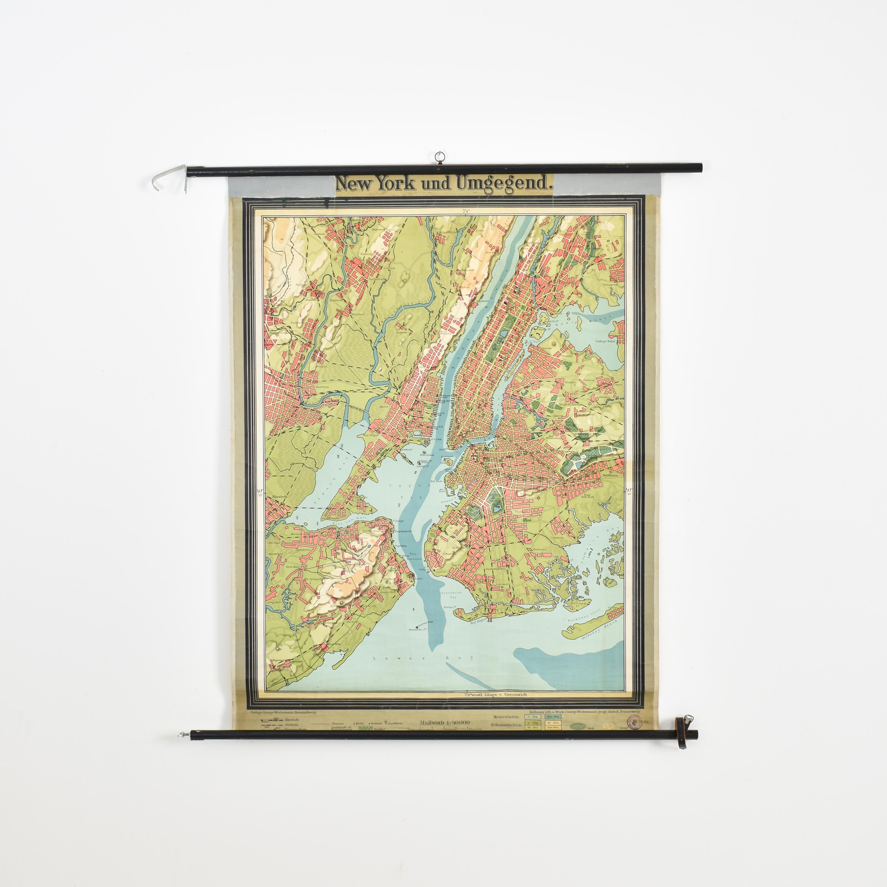 Antique New York Map By Westermann

A rare early school pull down wall map of New York. The map shows the city of New York and its suburbs. Printed in vibrant colours on paper which is canvas backed. There is a black wooden hanging pole and the