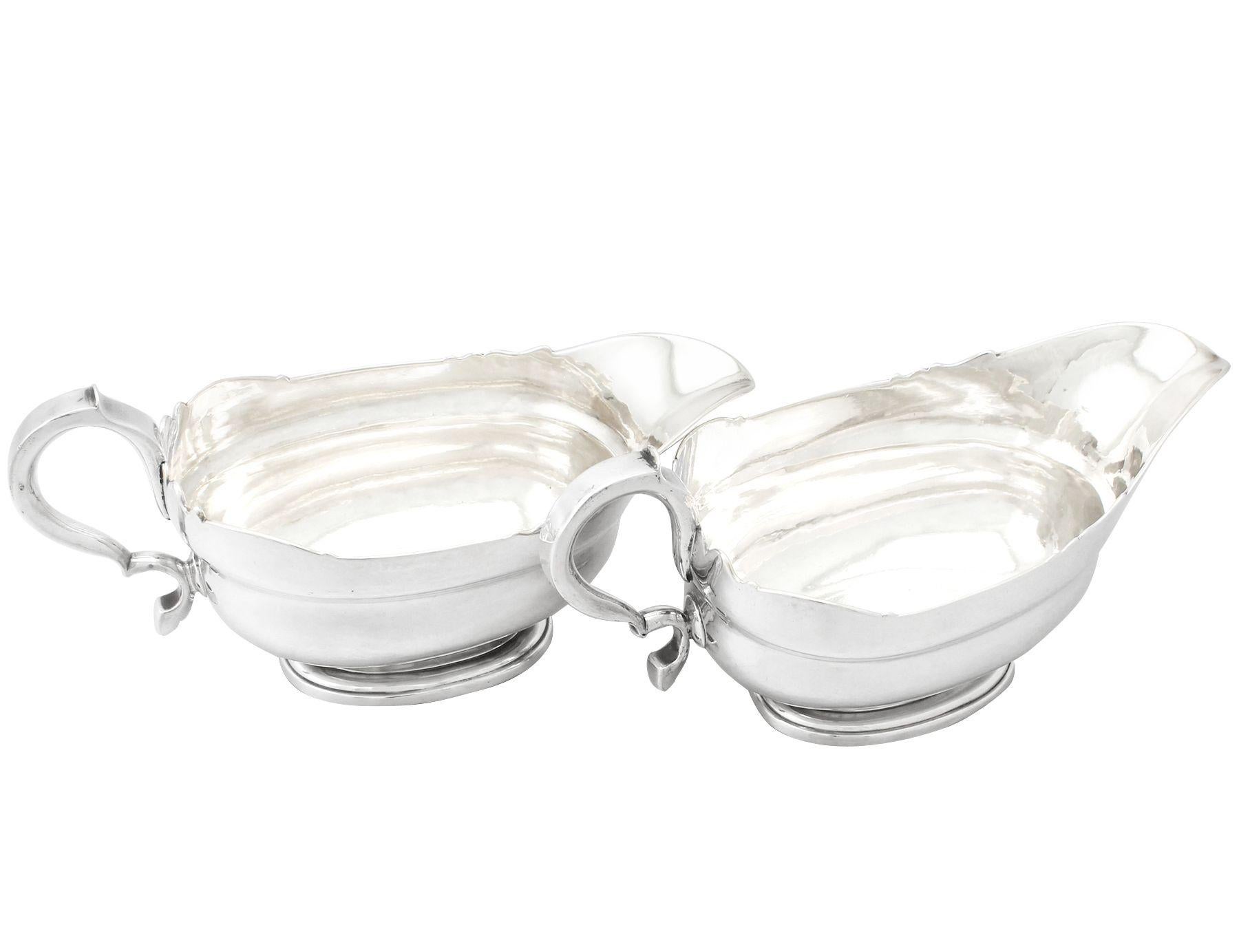 An exceptional, fine and impressive, rare pair of antique George II Newcastle sterling silver sauceboats made by Isaac Cookson, an addition to our Georgian dining silverware collection.

These exceptional and rare antique George II sterling silver