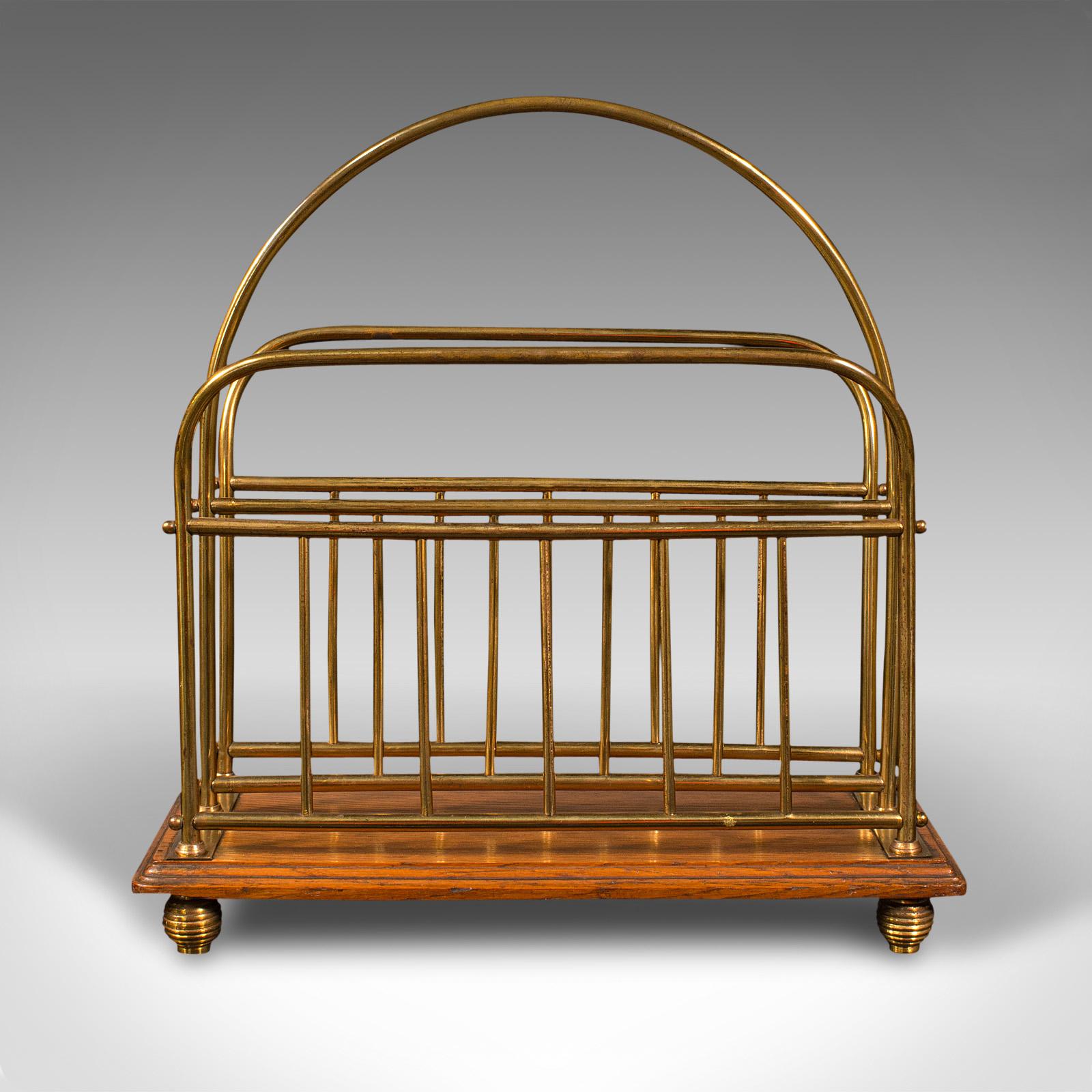 This is an antique table-top newspaper rack. An English, oak and brass magazine or letter Stand, dating to the Victorian period, circa 1880.

Attractive Stand, ideal for the morning paper or periodical
Displays a desirable aged patina and in good