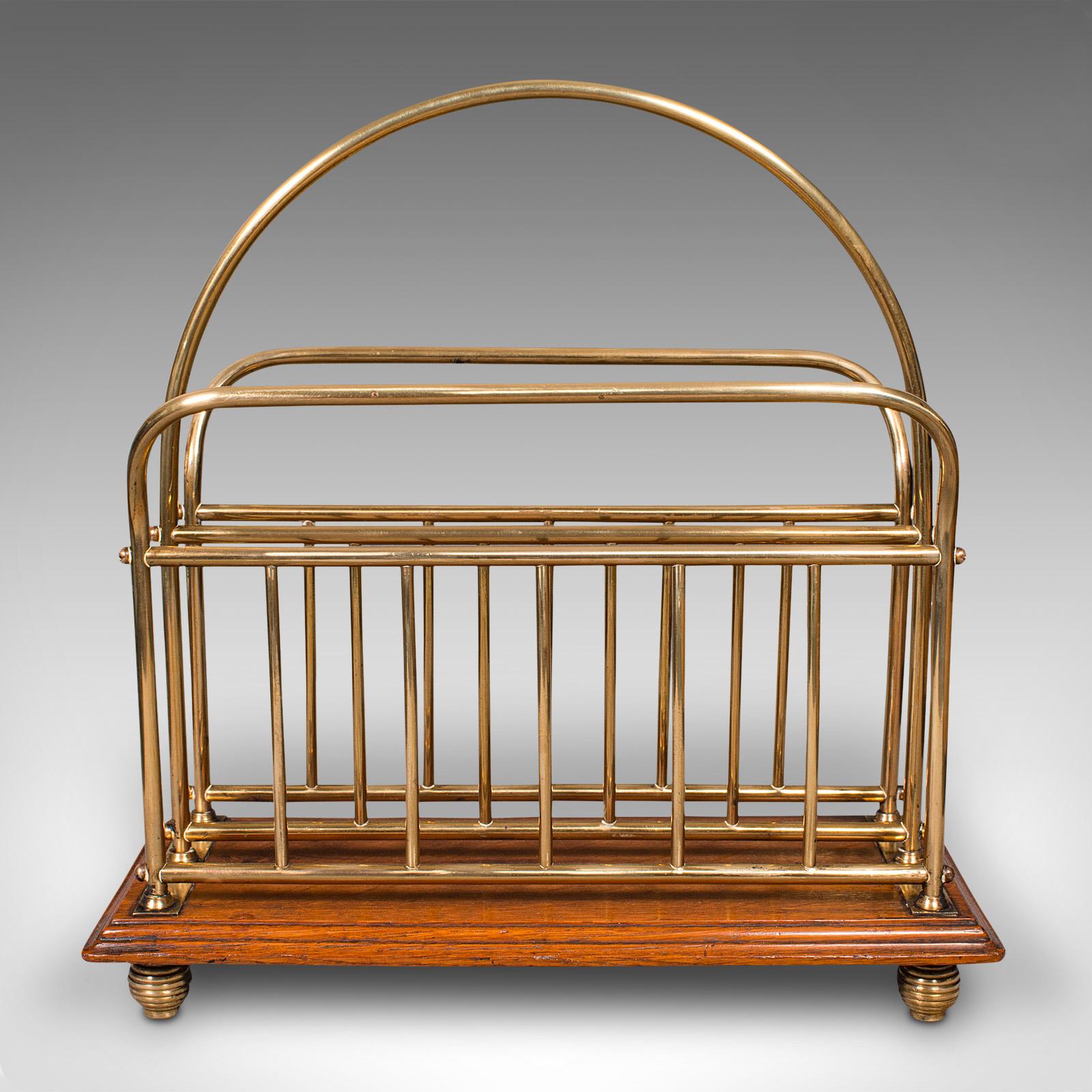 This is an antique newspaper stand. An English, oak and brass magazine or letter rack, dating to the Victorian period, circa 1880.

Delightful antique stand for arranging your newspapers or magazines
Displays a desirable aged patina and in good