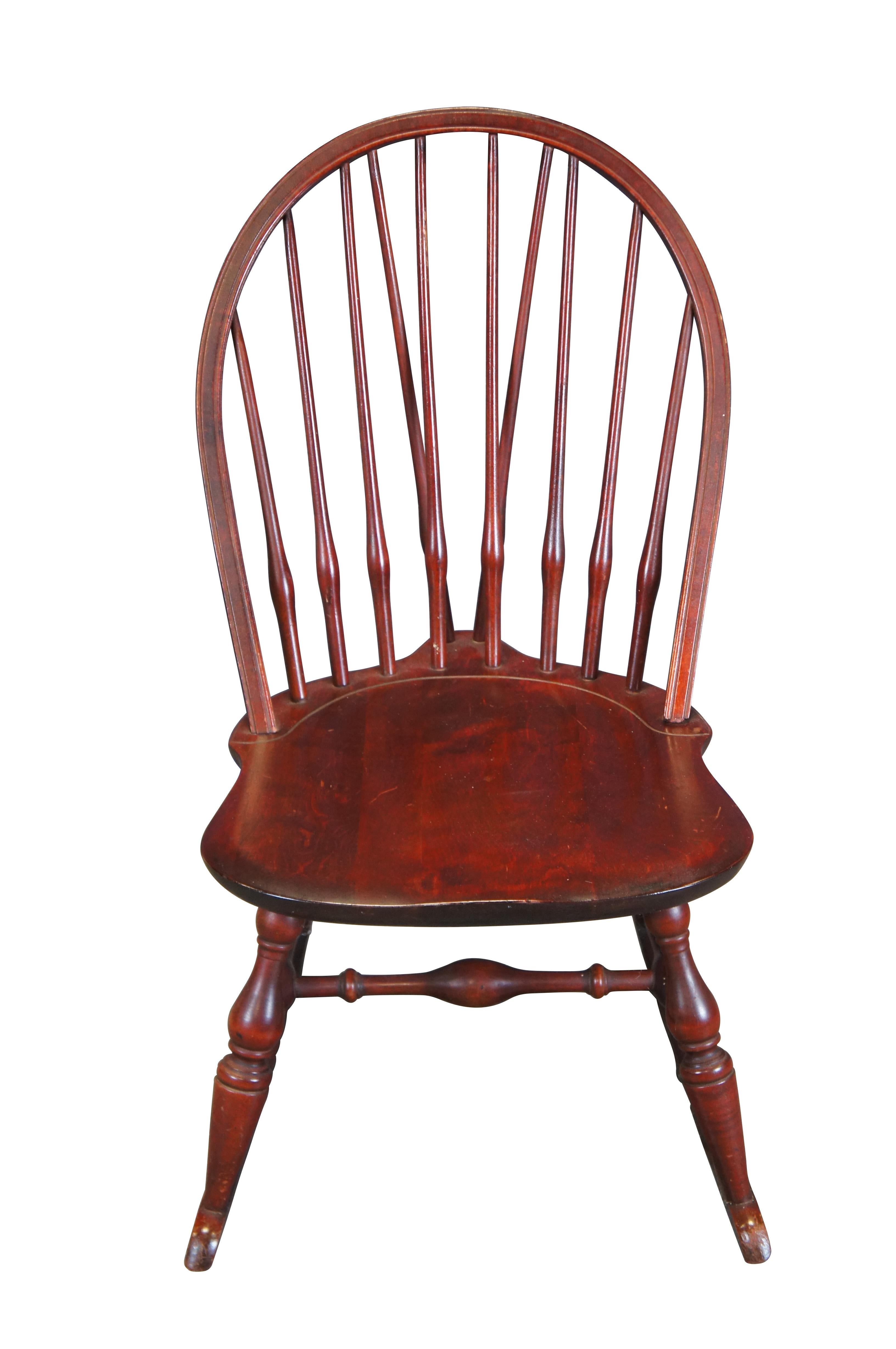 Vintage Nichols and Stone windsor rocking chair or rocker featuring a slatted bentwood bow back design with turned supports and H stretcher.  

Nichols and Stone Founded: In the mid-1800s by Edmund Nichols as a small chair shop in Westminster. In