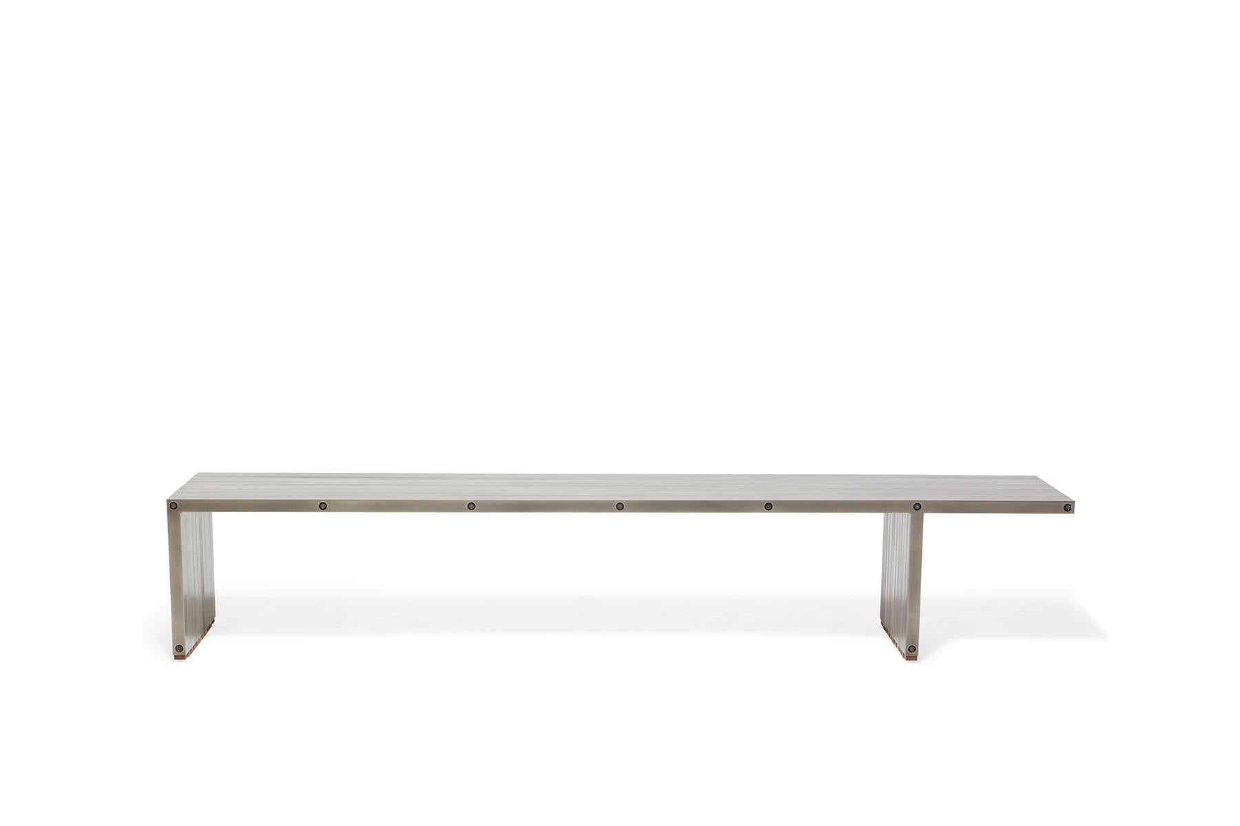 The Compression Bench by Stephen Kenn is a celebration of simplicity and strength. The bars are held together without nails or welds, but through compression along steel rods. The Compression Bench can be paired with the matching Compression Table