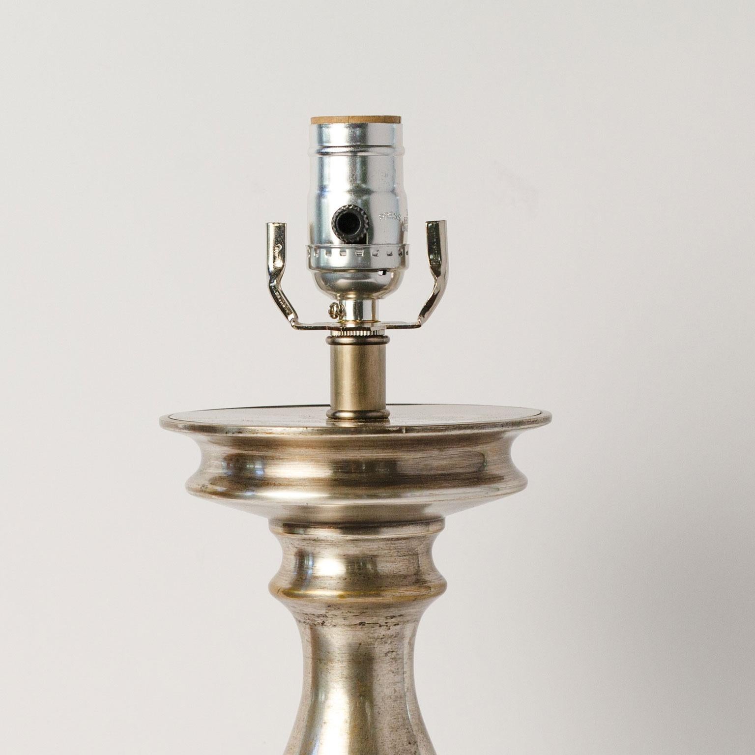 Antique nickel lamp (circa 1910-1930)  This Belgian table lamp is newly-wired for use within the USA and sold without a shade. The nickel on cast brass table lamp is of nice quality and heft.  It is simple and classic and could go in almost any