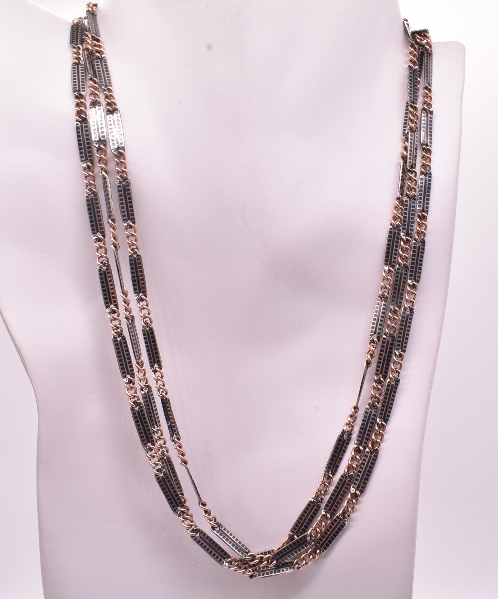 This niello chain was made from a an ancient technique called niello; the ancient art of of decorating silver which was revived in the 19th century and adopted by English jewelry artisans. The word Niello derives from the Latin form of niger, or