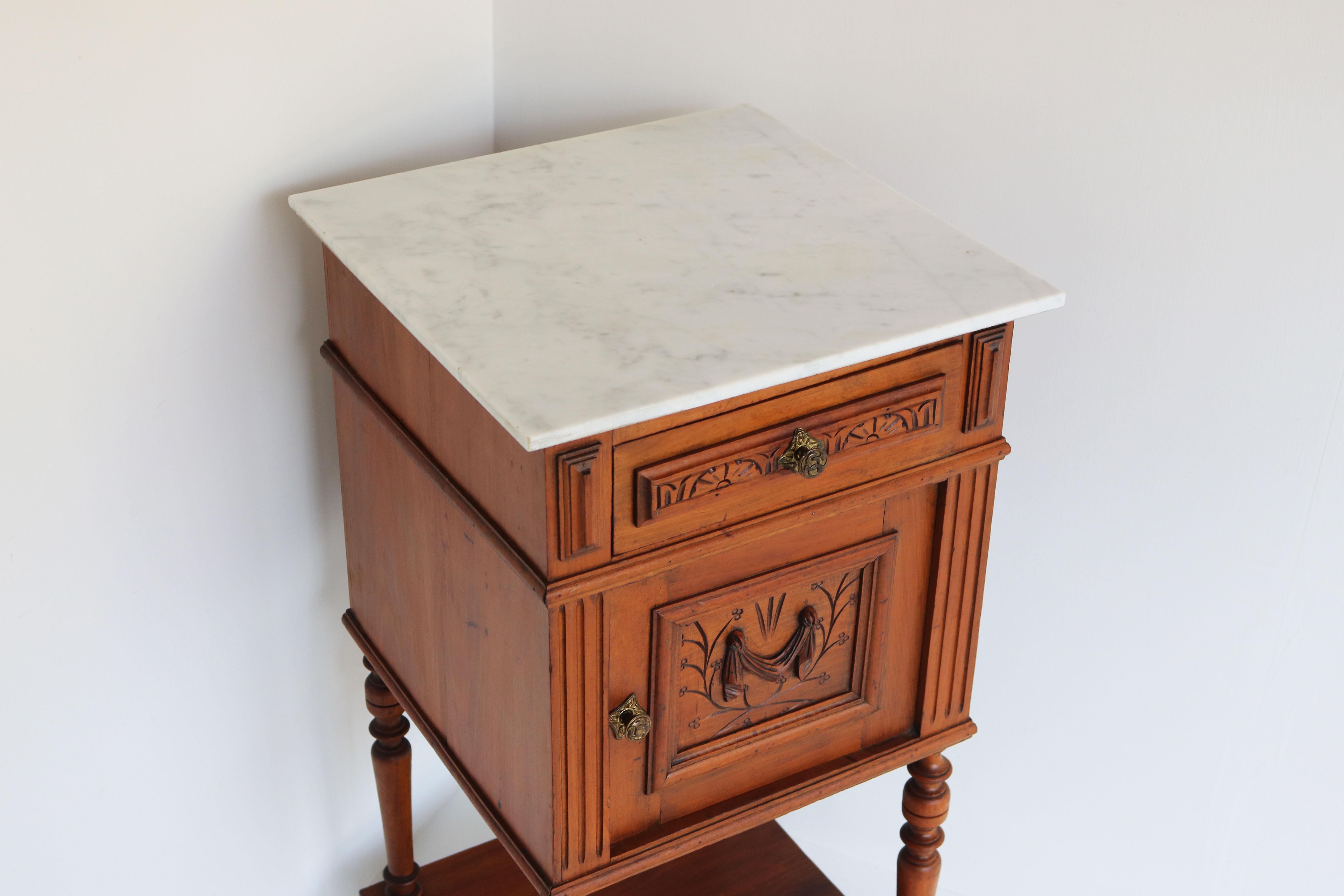 Gorgeous antique French 19th century night stand / bedside table 
The cabinet is made from Fruitwood with hand-carved decoration, really nice craftsmanship and attention to detail. 
The cabinet has a Italian Carrara marble top which combines