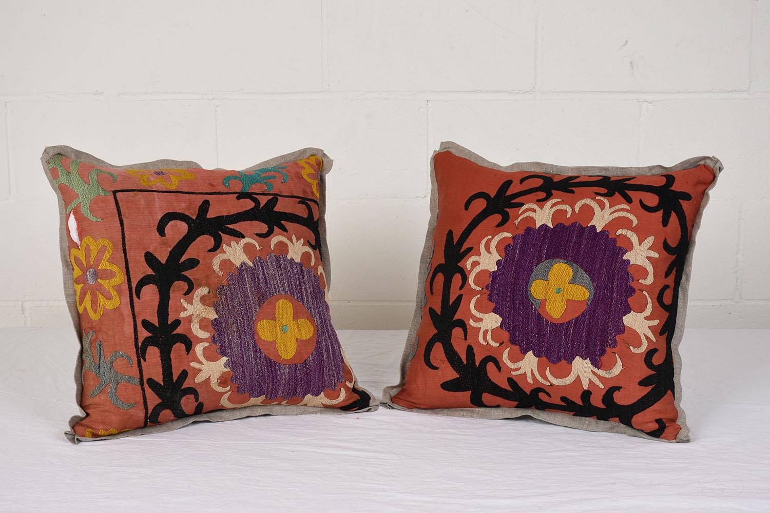 Elevate your interior with our exquisite pair of antique pillows, meticulously crafted from authentic Nim Suzani embroidered textiles. Combined with a neutral sand-colored Belgium linen fabric, these pillows blend antique charm with modern