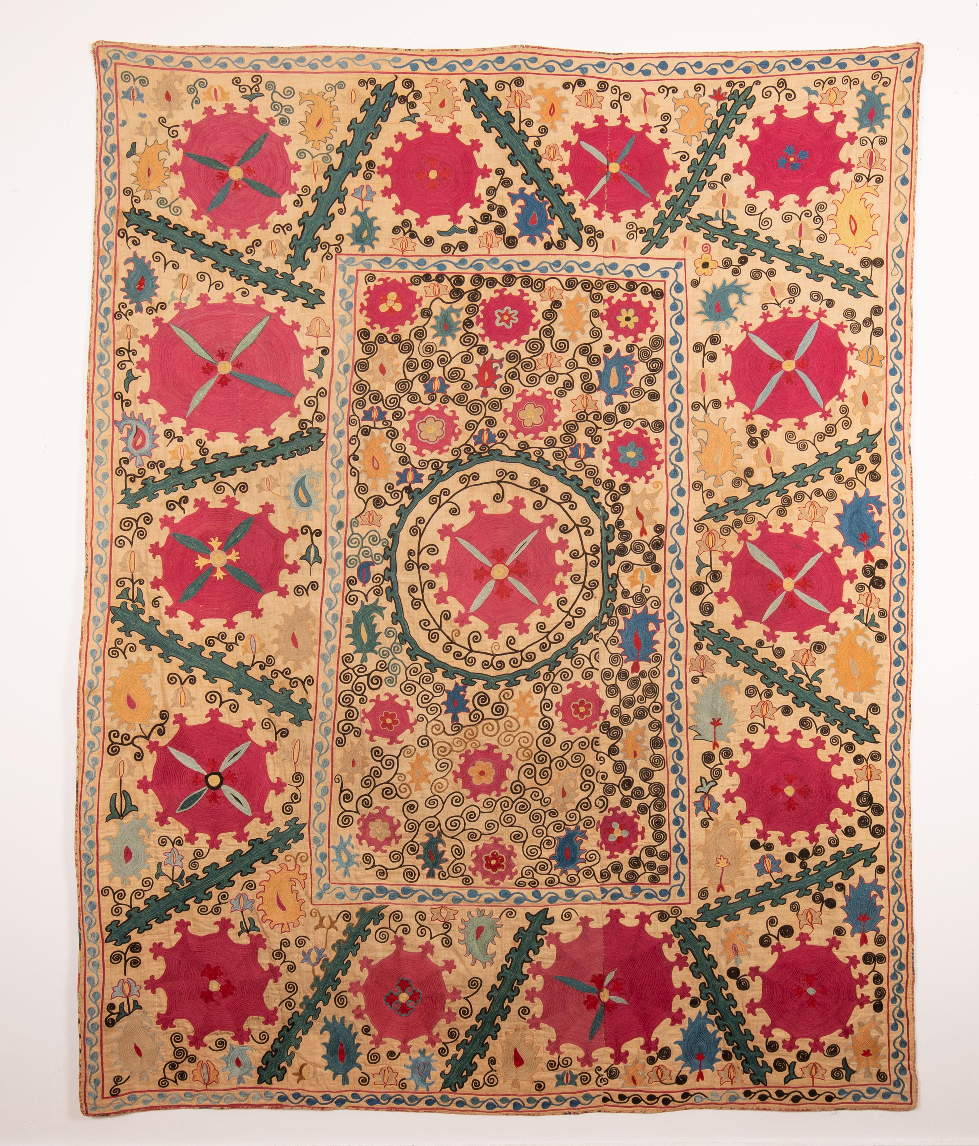 19th C. Super Colorful Nim Suzani,( means- half -size suzani but there is not a standard size, so the term  usually refers to smaller suzanis ) 
Uzbekistan Central Asia

The piece has its original backing and ikat facing.

143 x 184 cm / 56.29 x