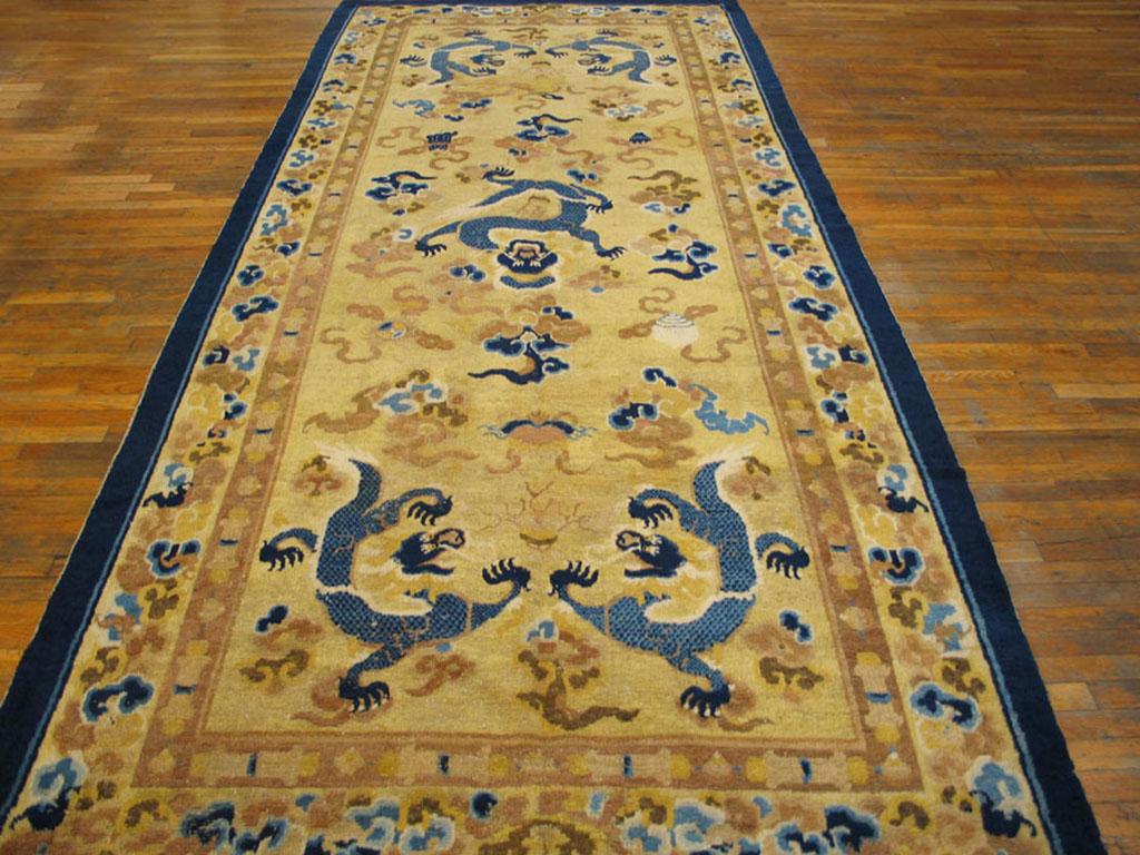 Late 18th Century Chinese Ningxia Kang Carpet
Five dragons writhe and soar on a light yellow ground on this classically rendered long carpet from northern China, circa 1800. Flaming pearls, Buddhist symbols and cloud knots add exotic elements. The