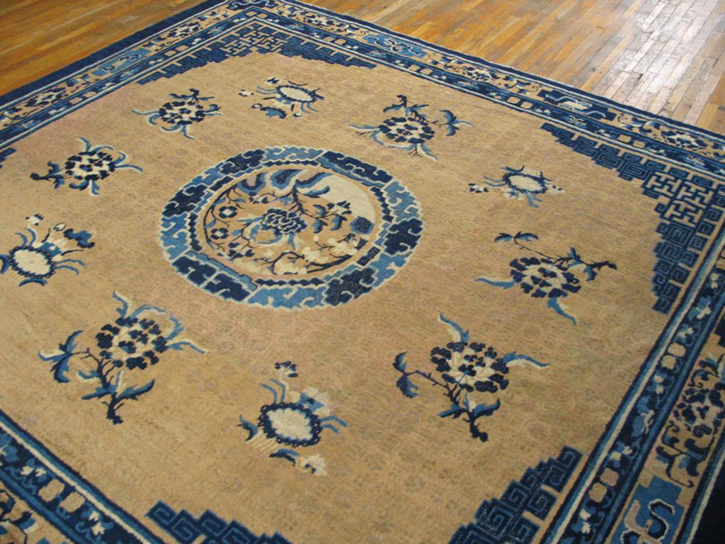 Square carpets are a Ningxia specialty. The subtle tone-on-tone rosette field pattern sets off a micro-landscape cloud wreath medallion, fret corners incorporating swastikas and various styles of paeonies. The deep gold border of this antique