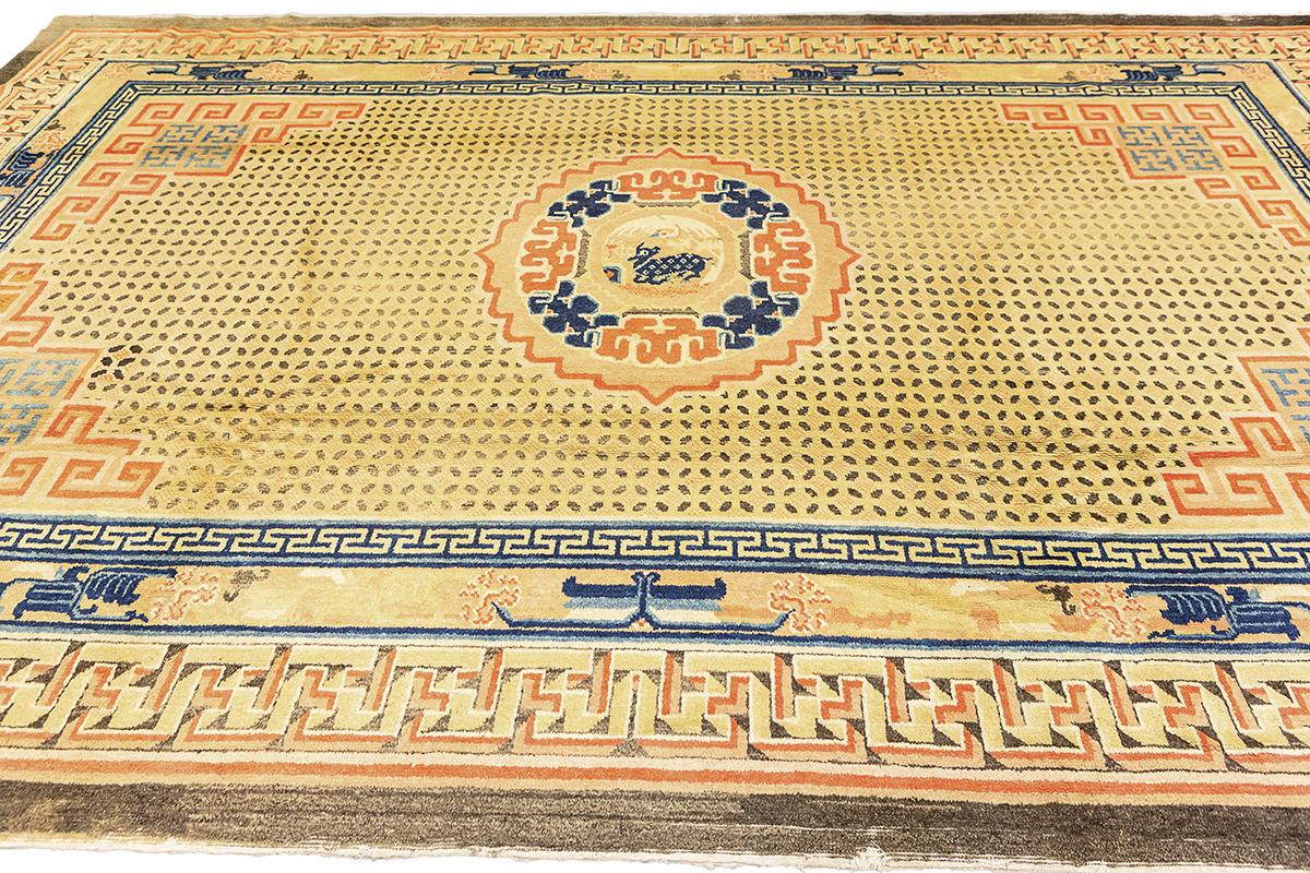 Immerse yourself in the timeless elegance of East Asian artistry with this exquisite Antique Ningxia rug, distinguished by a captivating central medallion that draws the eye and soul into its celestial narrative. Originating from the historical