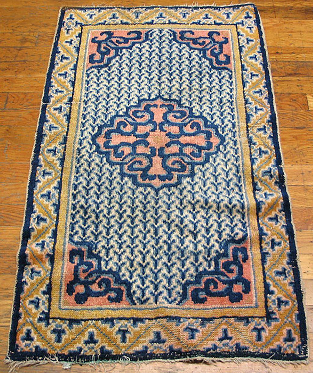 Early 19th Century Ningxia Rug ( 2' x 3'6'' - 60 x 108 )
The ivory field displays a giant lobed strap-work arabesque medallion with en suite corners, set on a “Y” shapes all-over pattern in 15 columns. A gold leafy zig-zag ornaments the main border