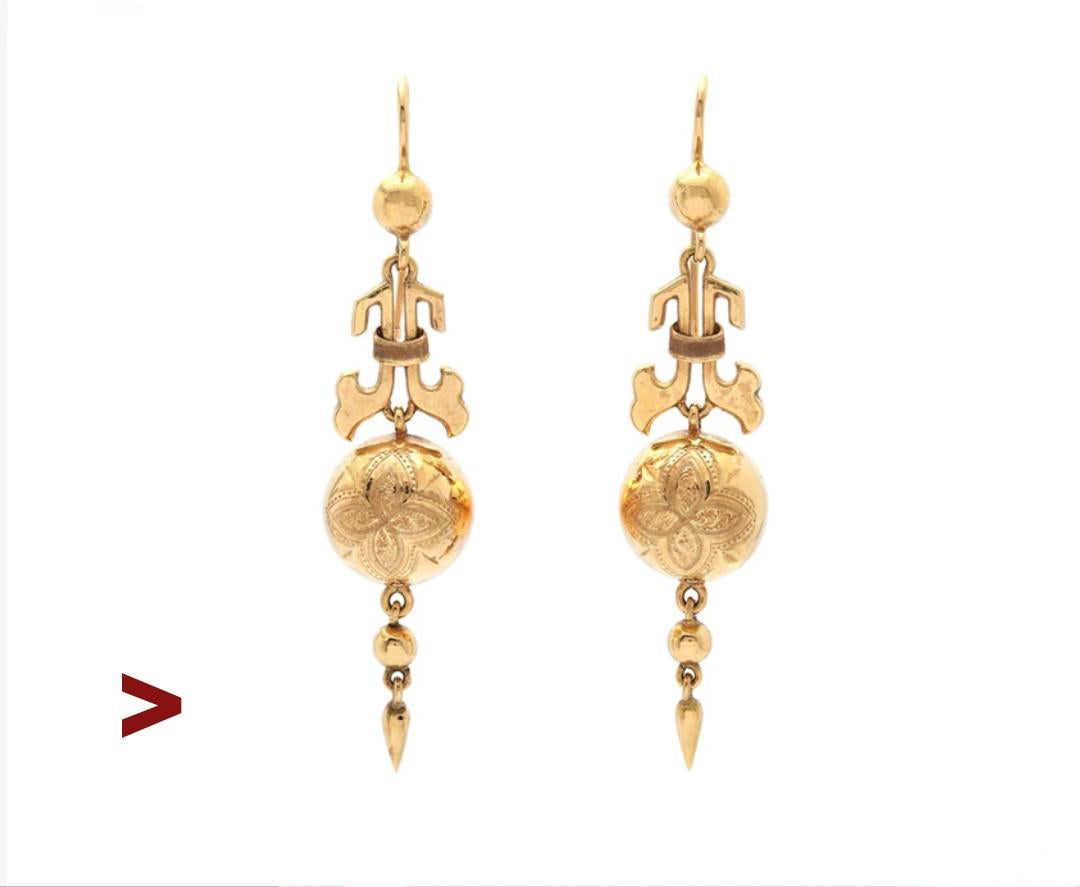 
A pair of old Swedish Viking Revival styled Earrings.Delicate and fine looking pair. Freely suspended shiny balls with delicate hand-engraved ornaments on the front sides.

Made ca. 1880s - 1900s. Hooks have Swedish hallmarks, the maker is GD & Co,