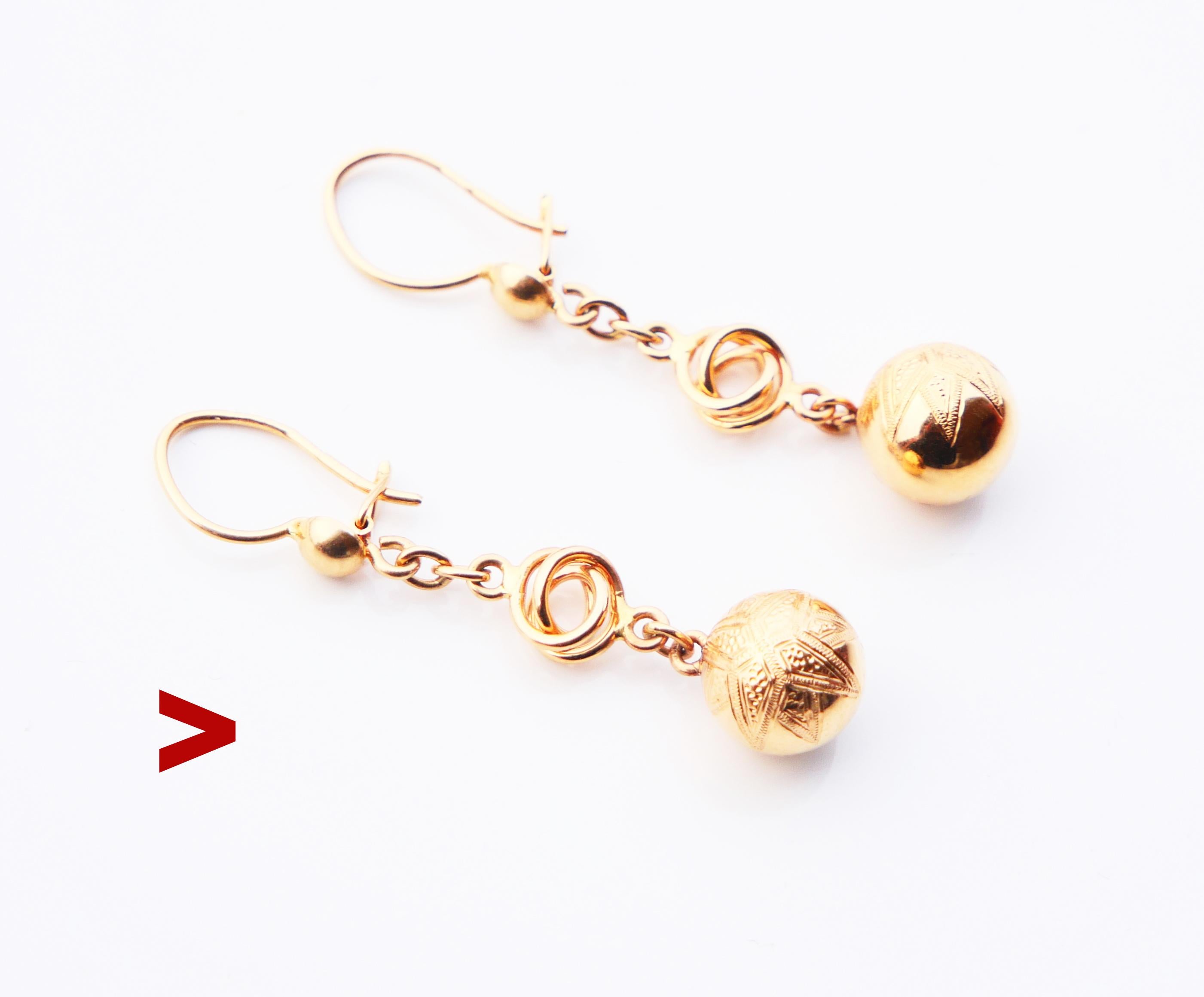 
A pair of old Swedish earrings with chained shiny balls. Delicate engraved ornamentations of Octagram eight-angled stars on front sides.

Made ca. 1920s -1930s. Hooks have Swedish hallmarks, Stockholm , 18K , all parts were tested solid 18K Yellow