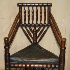 ANTiQUE NORMAN VIKING OR SCANDINAVIAN OAK & AGED BROWN LEATHER TURNERS CHAIR
